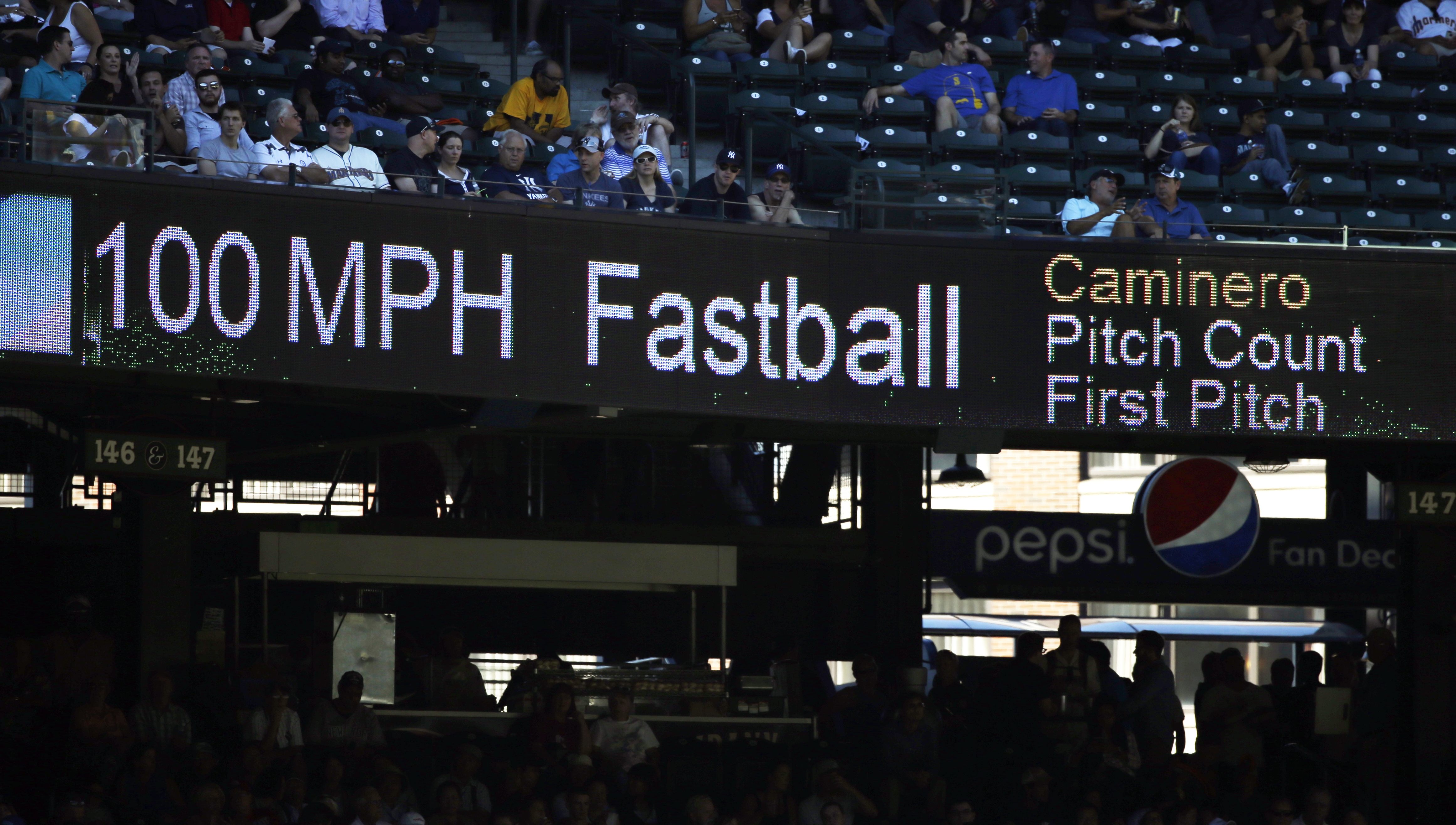 FILE - The 100 mph speed of Seattle Mariners' Arquimedes Caminero's fastball is shown on a scoreboard during a baseball game against the New York Yankees, Aug. 24, 2016, in Seattle. 
