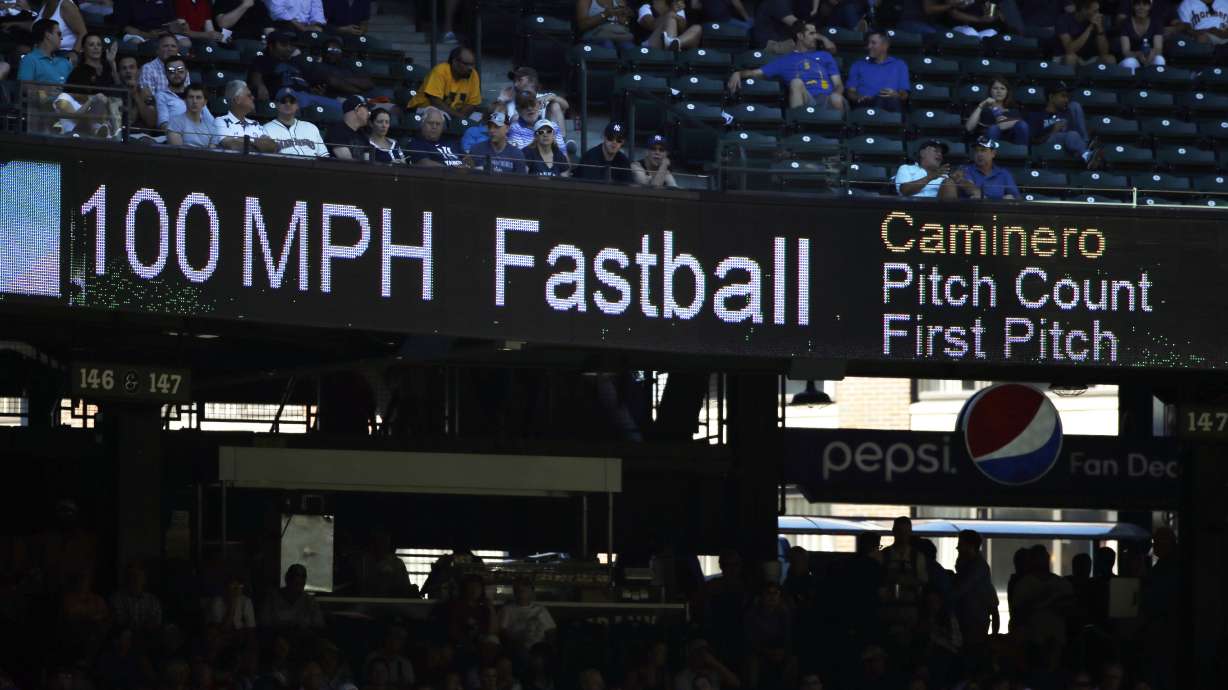 FILE - The 100 mph speed of Seattle Mariners' Arquimedes Caminero's fastball is shown on a scoreboard during a baseball game against the New York Yankees, Aug. 24, 2016, in Seattle.