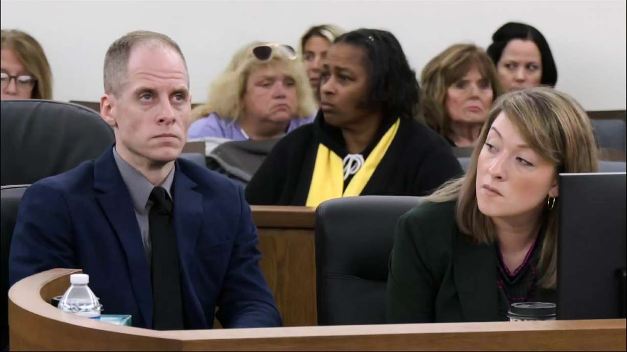 Caleb Flynn sits next to Emily Smith, one of his attorneys, on Monday, in the Miami County Court of Common Pleas in Troy, Ohio. Flynn was convicted of fatally shooting his wife, Ashley Flynn, on Tuesday.
