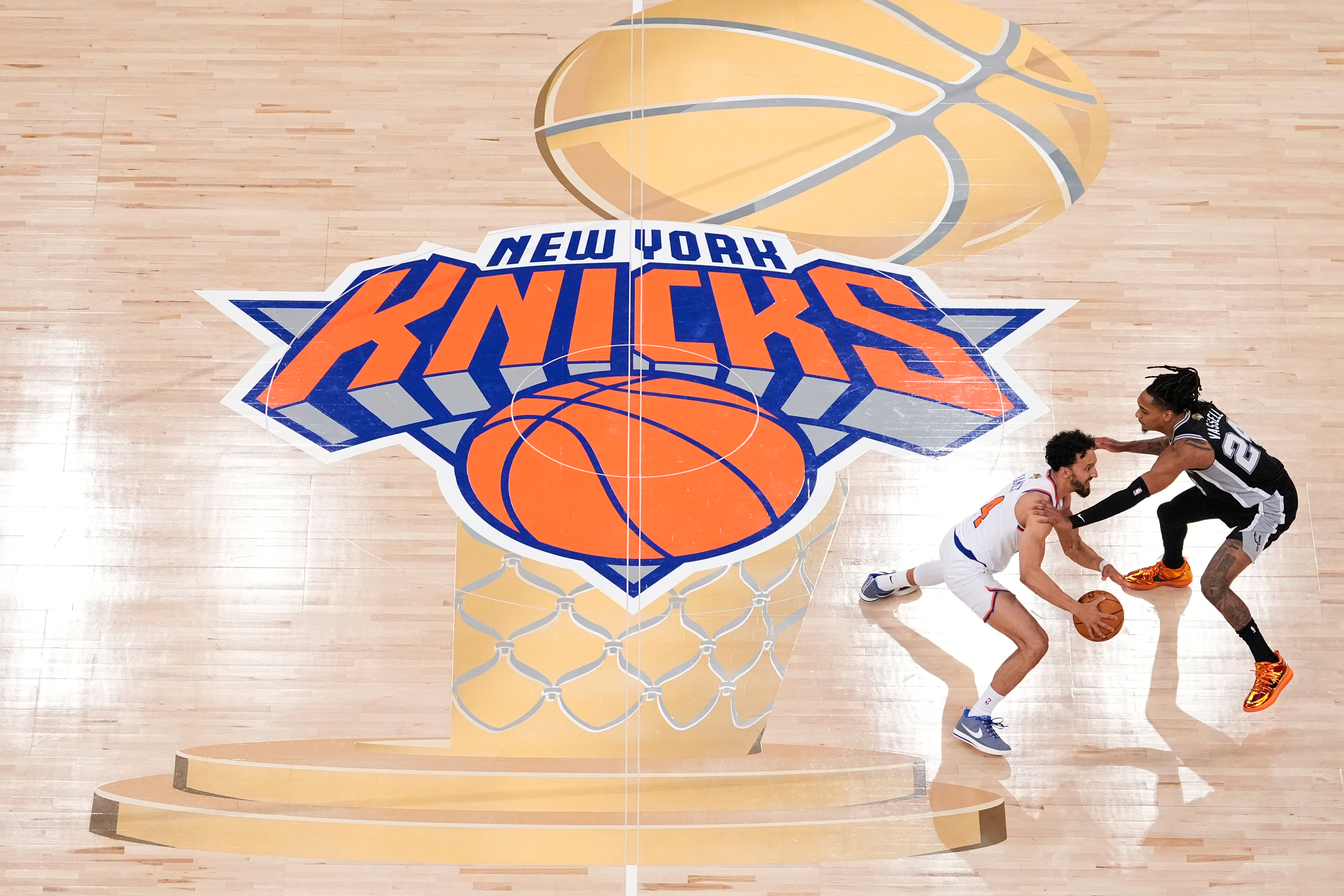 FILE - New York Knicks guard Landry Shamet (44) brings the ball up the court against San Antonio Spurs guard Devin Vassell (24) during the second half of Game 3 of the NBA Finals basketball series, June 8, 2026, in New York. 