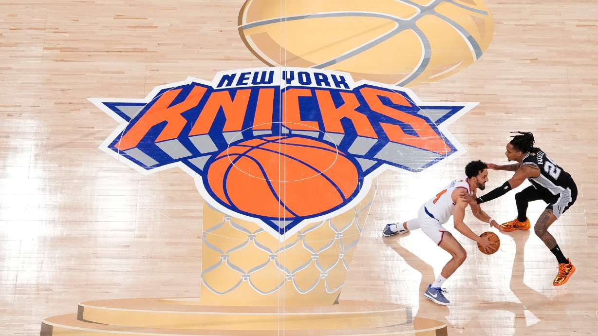 FILE - New York Knicks guard Landry Shamet (44) brings the ball up the court against San Antonio Spurs guard Devin Vassell (24) during the second half of Game 3 of the NBA Finals basketball series, June 8, 2026, in New York.