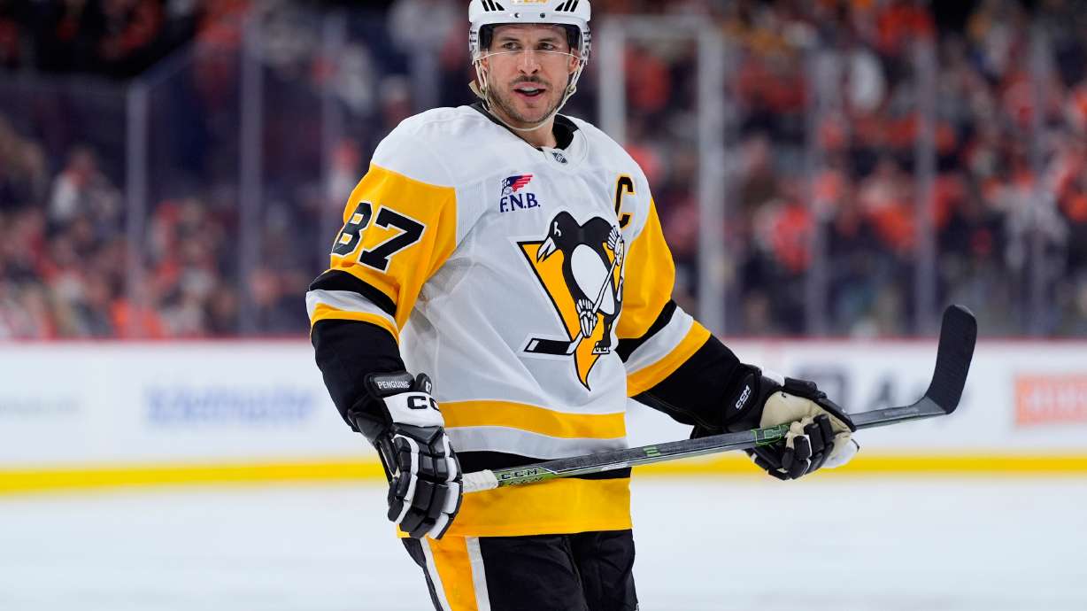 FILE - Pittsburgh Penguins' Sidney Crosby looks on during a break in Game 6 in the first round of the NHL hockey Stanley Cup playoffs series, April 29, 2026, in Philadelphia.