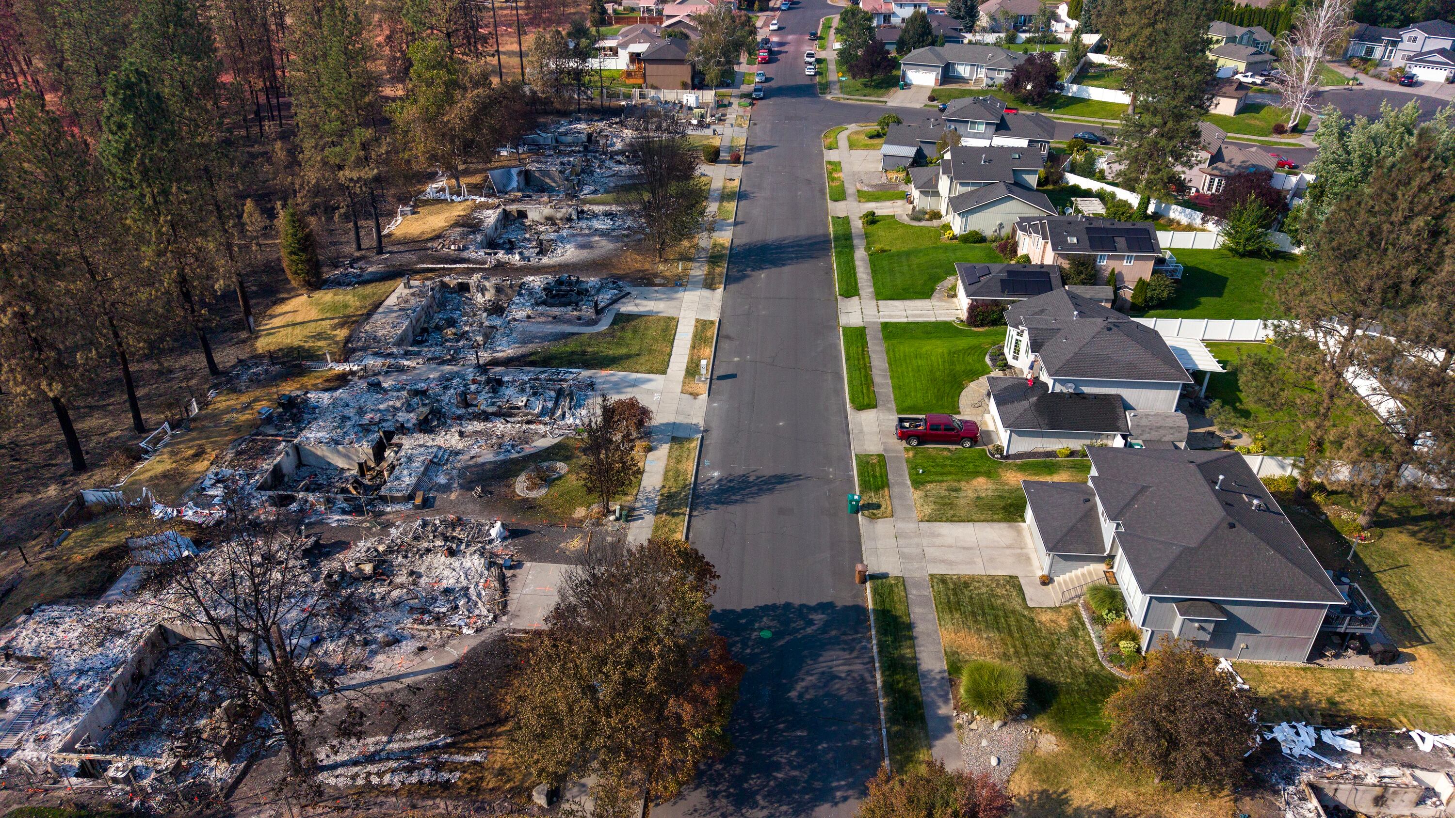Remnants of a the devastating wildfire which burned through neighborhoods in early August are shown in Spokane, Wash., on Aug 23. Sen. John Curtis' Wildfire Emissions Prevention Act passed the Senate via a fast-track process on Tuesday.