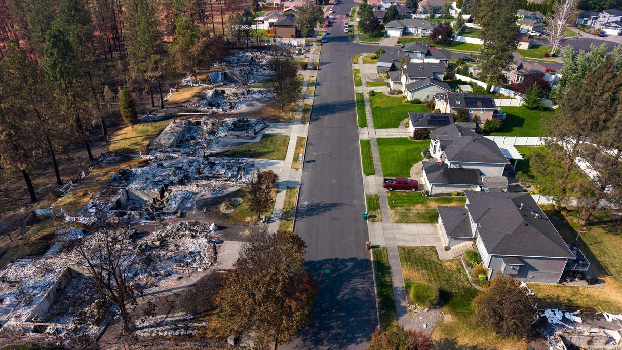 Remnants of a the devastating wildfire which burned through neighborhoods in early August are shown in Spokane, Wash., on Aug 23. Sen. John Curtis' Wildfire Emissions Prevention Act passed the Senate via a fast-track process on Tuesday.
