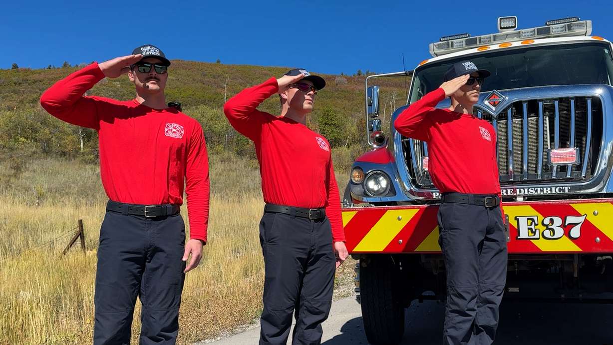 Firefighters from the Wasatch Fire District saluted as the procession went by on Tuesday.