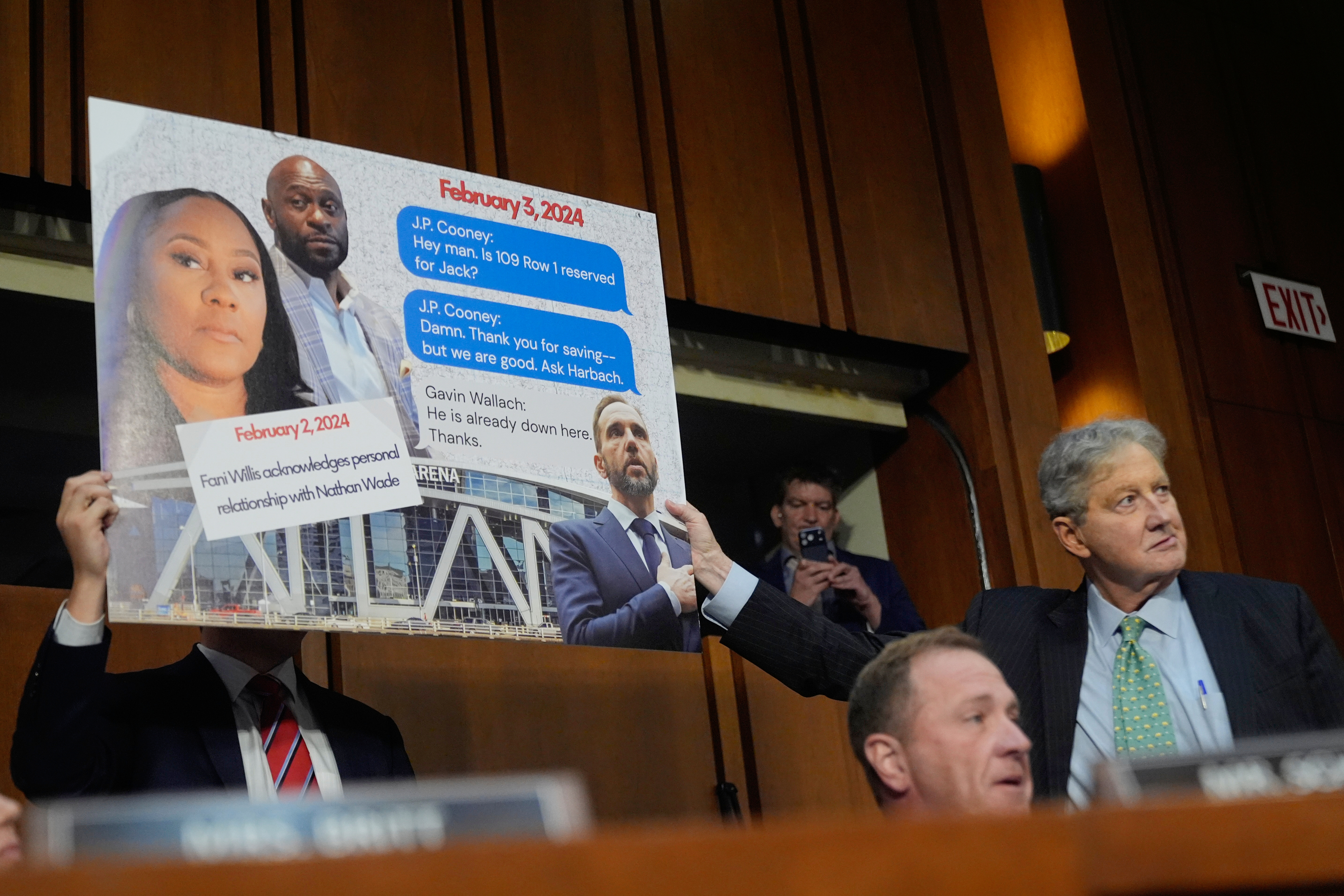 Sen. Eric Schmitt, R-Mo, seated right, with Sen. John Kennedy, R-La., standing right, during a discussion about text messages with former special counsel Jack Smith, as Smith testifies before the Senate Judiciary Committee on Capitol Hill, in Washington, Tuesday, Sept. 29, 2026, as they probe his investigation of President Trump. 