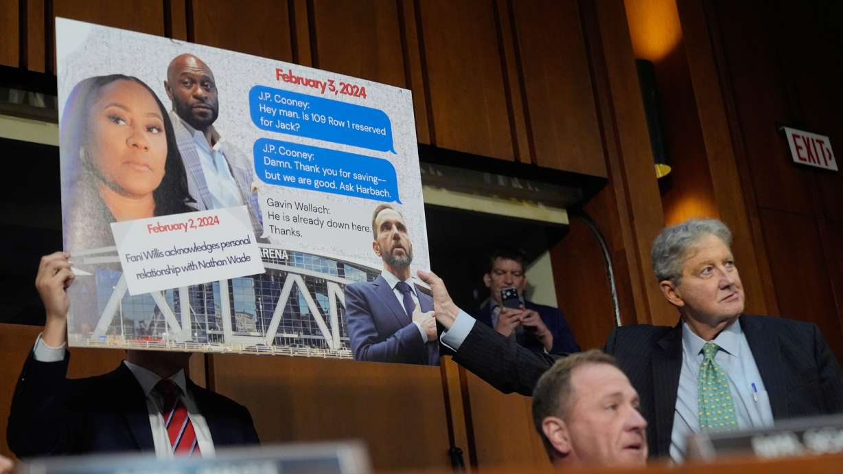 Sen. Eric Schmitt, R-Mo, seated right, with Sen. John Kennedy, R-La., standing right, during a discussion about text messages with former special counsel Jack Smith, as Smith testifies before the Senate Judiciary Committee on Capitol Hill, in Washington, Tuesday, Sept. 29, 2026, as they probe his investigation of President Trump.