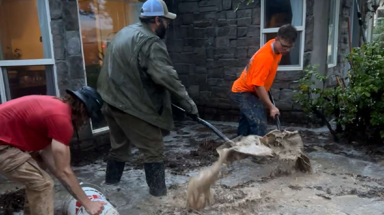 Sabrina Dubay says the community around Orderville showed up in large numbers to help after a flash flood pushed through the front of her home, nearly knocking ATVs and a camper into the river.