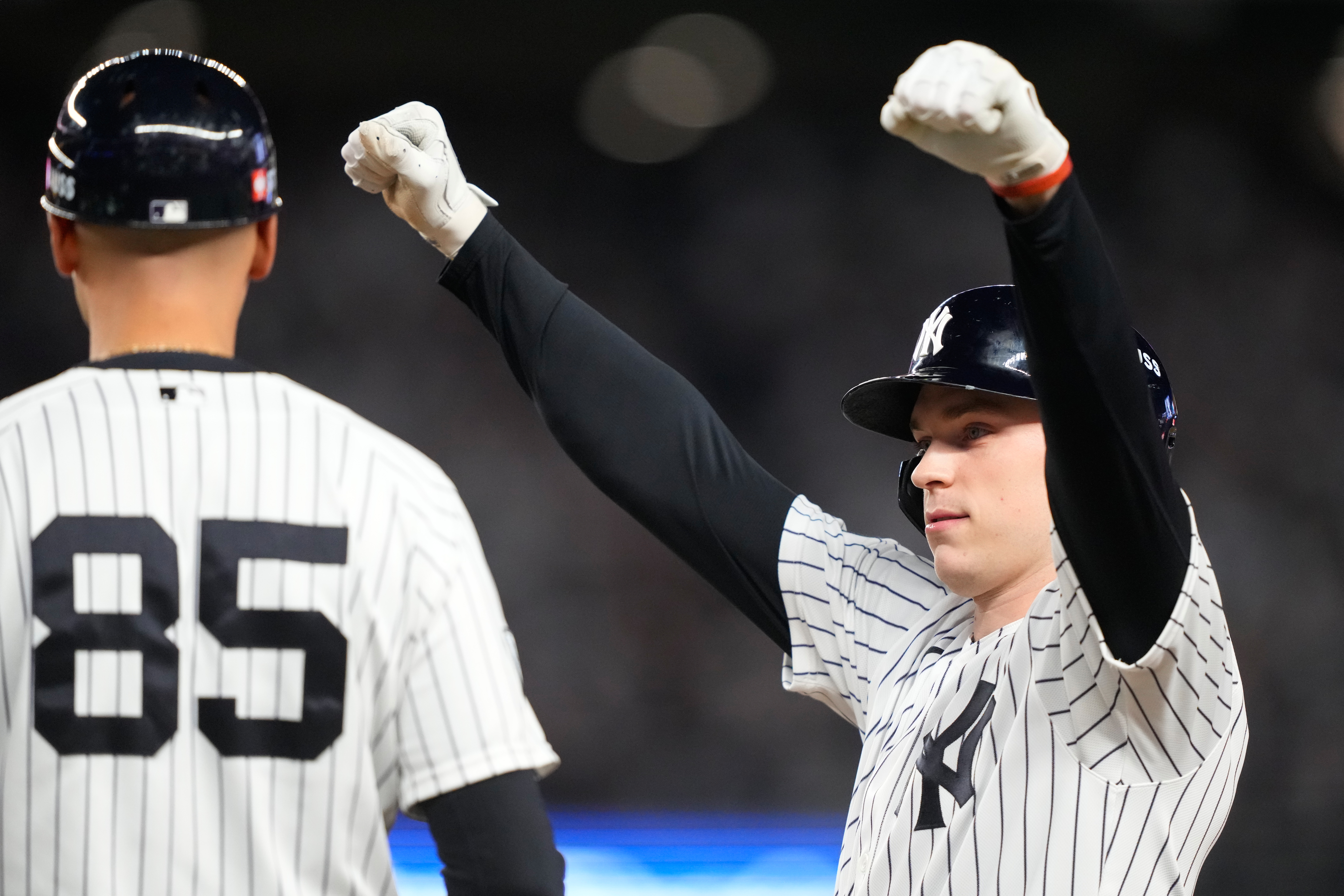New York Yankees' Ben Rice, right, reacts next to first base coach Dan Fiorito, after collecting an RBI on a bases loaded single against the Boston Red Sox during the seventh inning in Game 1 of baseball's American League Wild Card Series, Tuesday, Sept. 29, 2026, in New York. 