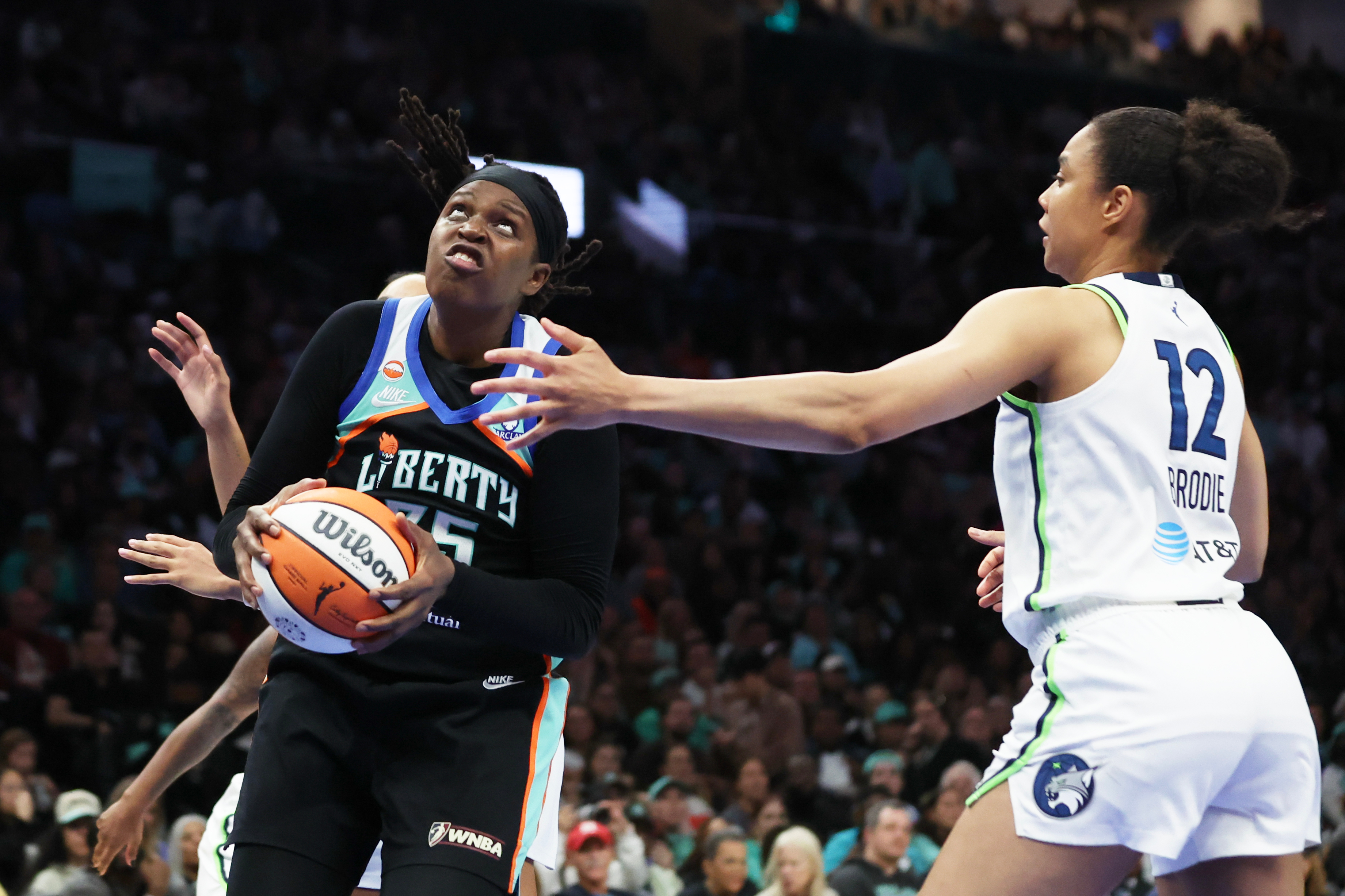 New York Liberty center Jonquel Jones goes up to the basket while Minnesota Lynx forward Nia Brodie (12) defends during the second half of Game 2 of a WNBA basketball first-round playoff series, Tuesday, Sept. 29, 2026, in New York. 