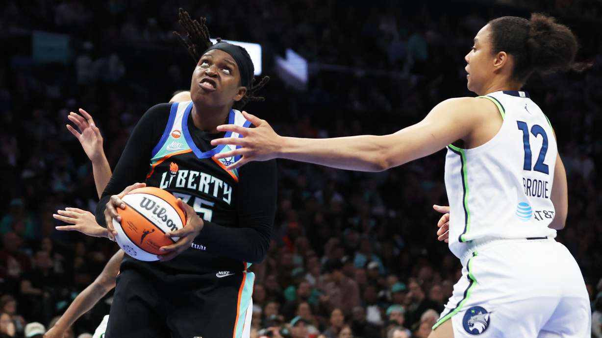 New York Liberty center Jonquel Jones goes up to the basket while Minnesota Lynx forward Nia Brodie (12) defends during the second half of Game 2 of a WNBA basketball first-round playoff series, Tuesday, Sept. 29, 2026, in New York.
