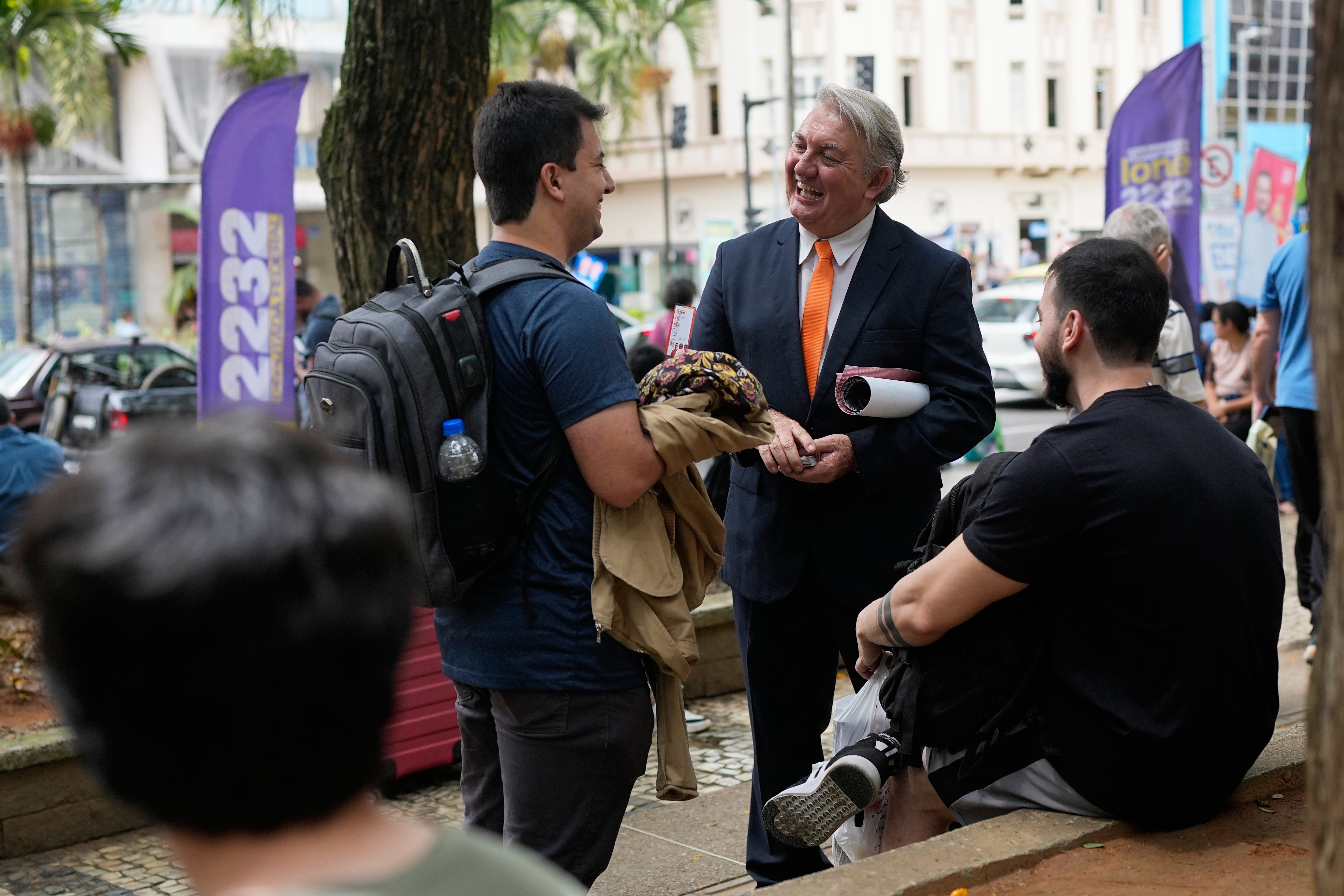 Plinio Vicentin Jr., center, who is running for federal lawmaker as "Plinio Trump," with the Novo Party representing Minas Gerais state, campaigns ahead of the general election in Juiz de Fora, Minas Gerais state, Brazil, on Monday.