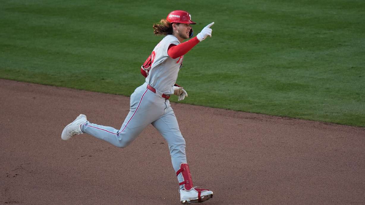 Philadelphia Phillies' Alec Bohm celebrates his home run against the Atlanta Braves in the 10th inning during Game 2 of baseball's National League Wild Card Series Wednesday, Sept. 30, 2026, in Atlanta.