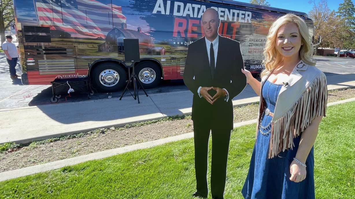 Kylie Kremer with Humans First poses with a cardboard cutout of Kevin O'Leary, the main force behind the Box Elder County data center proposal. Humans First brought its Data Center Revolt tour to Brigham City on Wednesday.