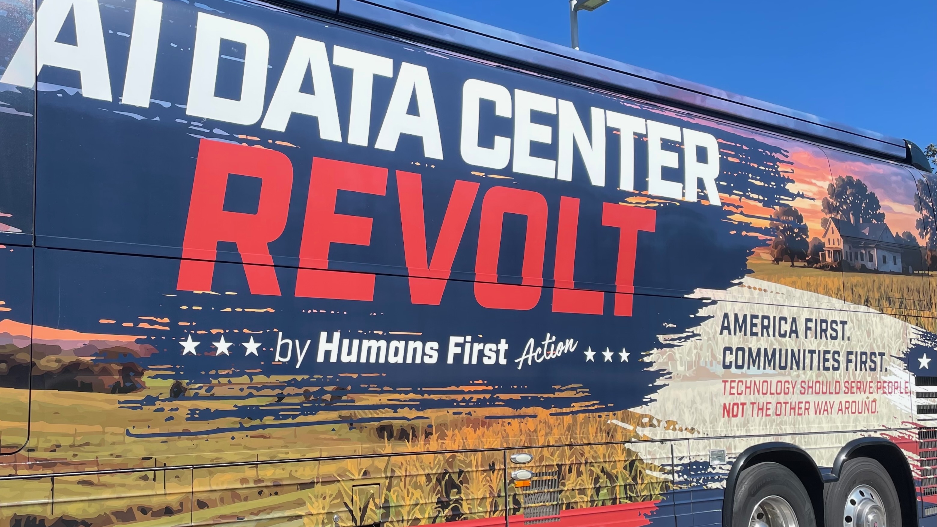 A bus hauls participants to Brigham City on Wednesday for the Humans First group's Data Center Revolt tour.