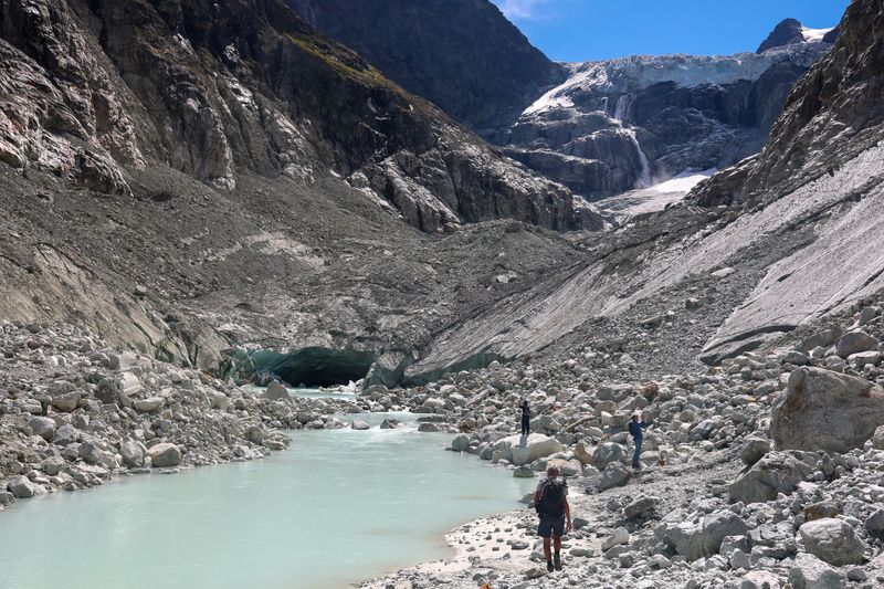 Hikers walk on the moraine at the Mont Mine glacier on a warm summer day amid climate change in Ferpecle near Evolene, Switzerland, September 3, 2026.