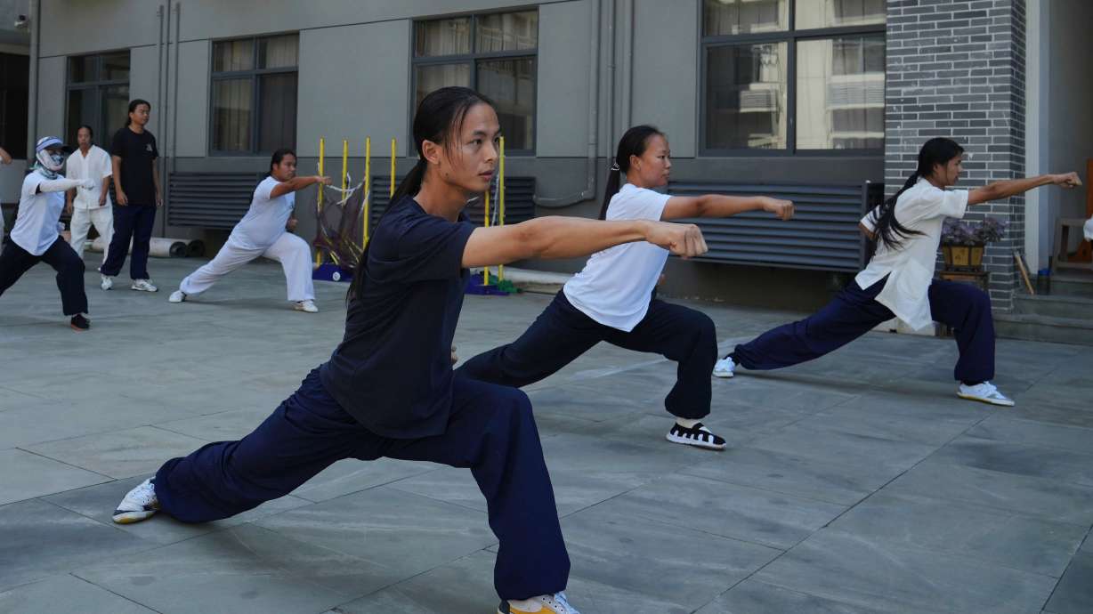 Students practice at the Wudang Taoist Traditional Kung Fu Academy near Wudang Mountain in Shiyan city in central China's Hubei province on Friday, Sept. 4.
