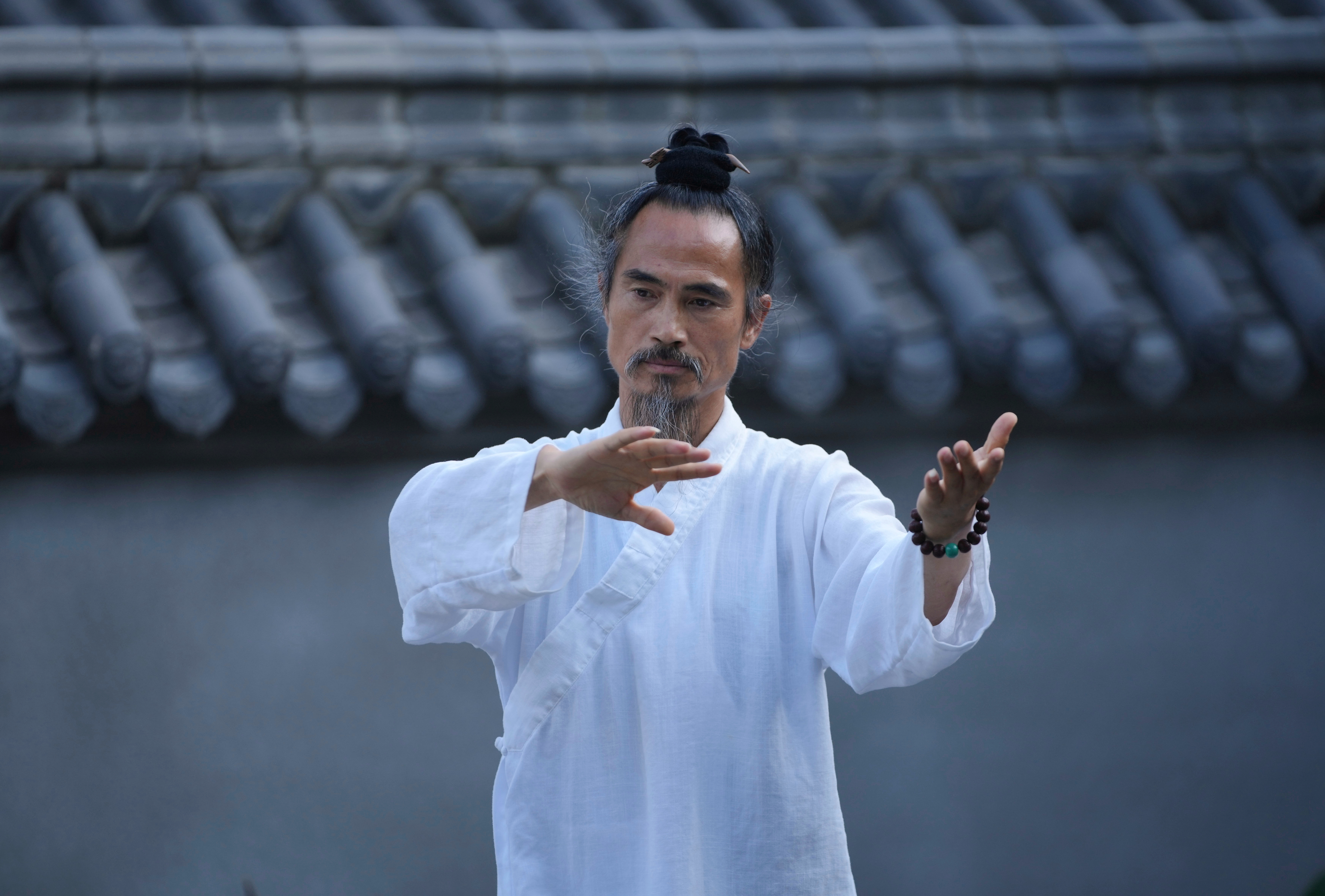 Yuan Shimao, founder of Wudang Taoist Traditional Kung Fu Academy, performs on the grounds of the academy near Wudang Mountain in Shiyan city in central China's Hubei province on Friday, Sept. 4.