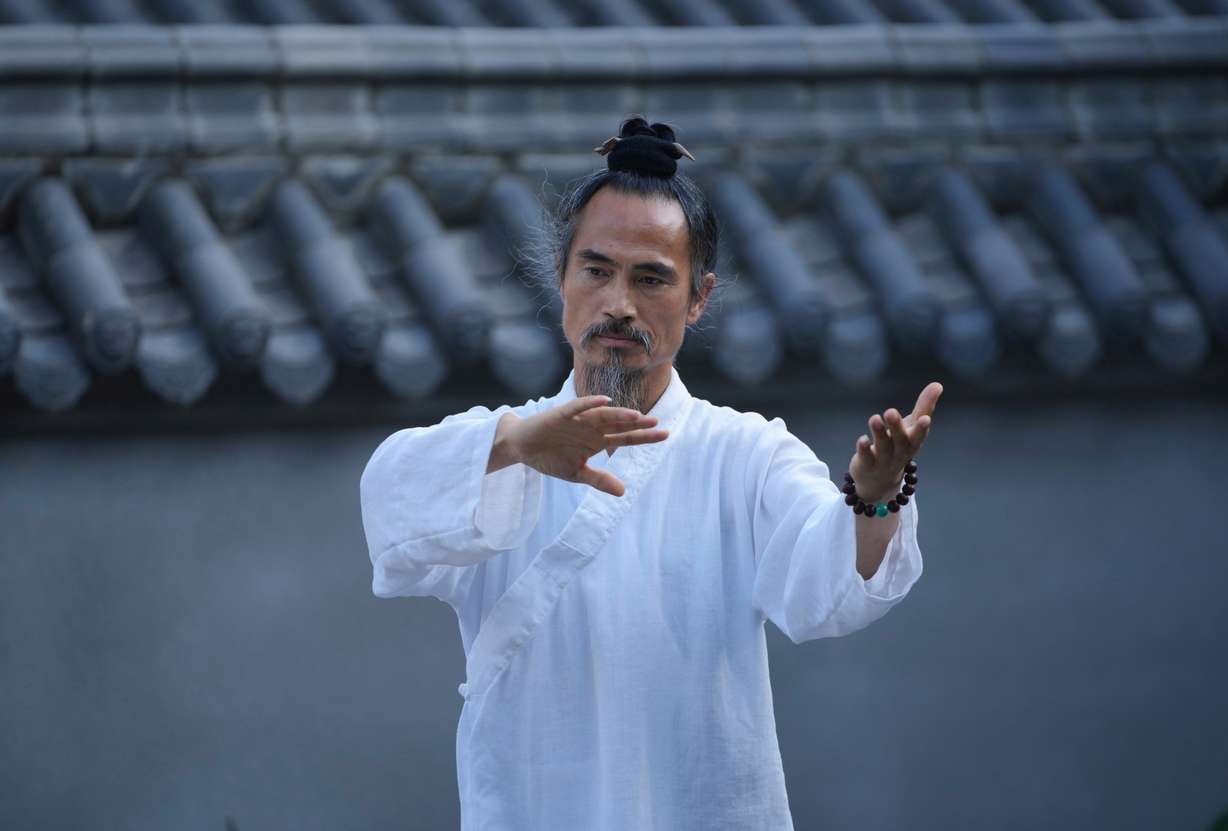 Yuan Shimao, founder of Wudang Taoist Traditional Kung Fu Academy, performs on the grounds of the academy near Wudang Mountain in Shiyan city in central China's Hubei province on Friday, Sept. 4.