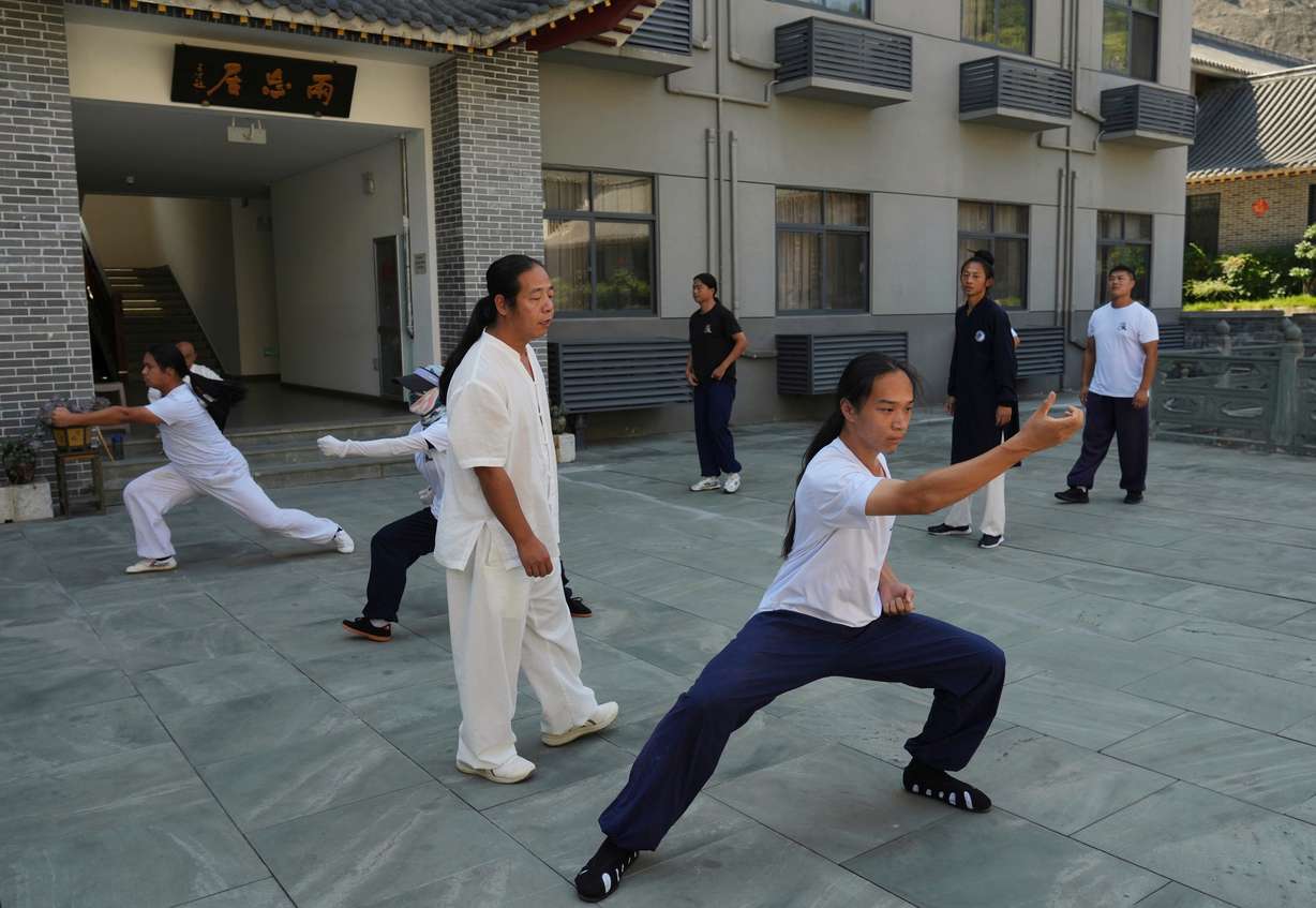 Students practice at the Wudang Taoist Traditional Kung Fu Academy near Wudang Mountain in Shiyan city in central China's Hubei province on Friday, Sept. 4.