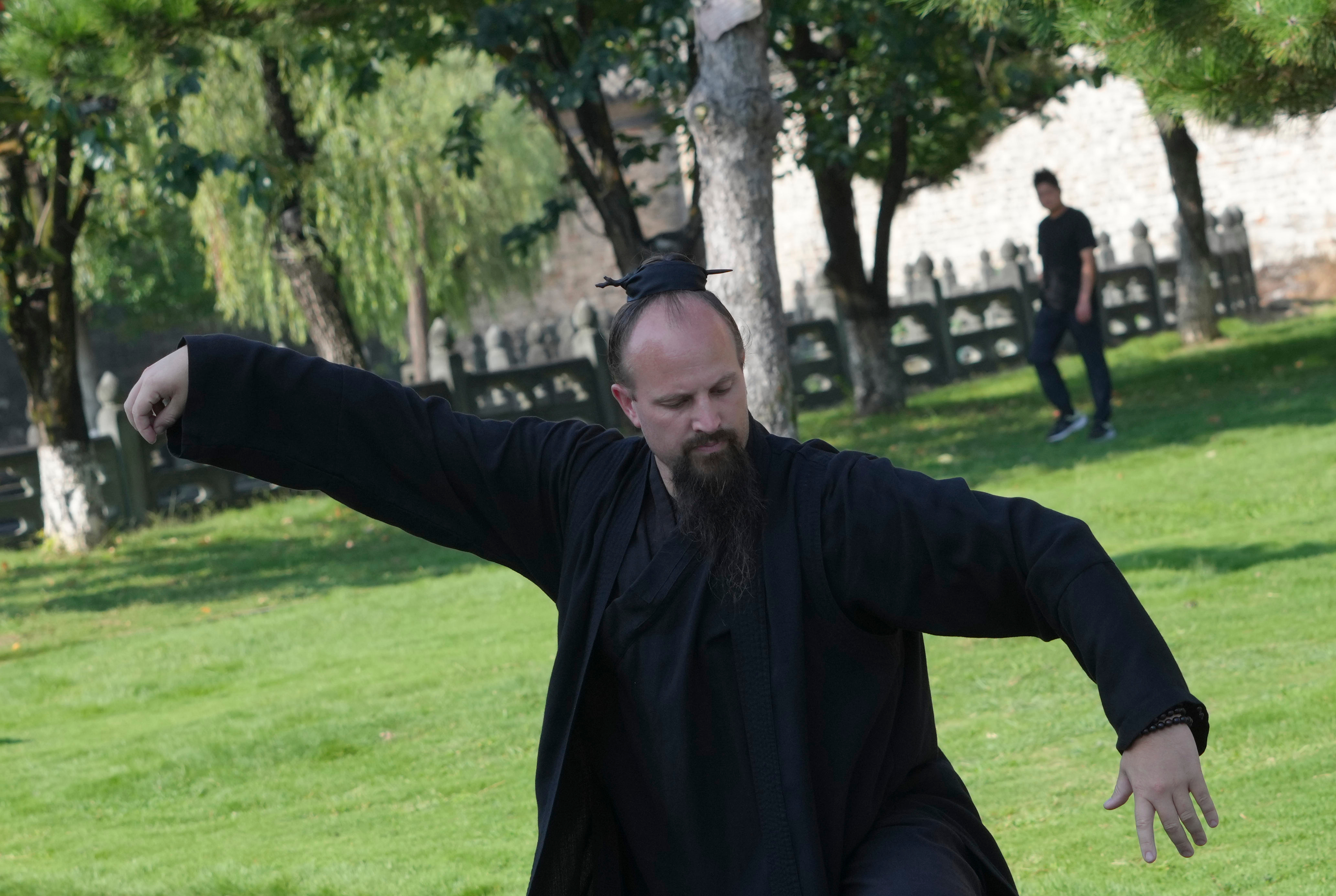 Jake Pinnick, from the United States, performs Wudang Tai Chi at Yuxu Palace near Wudang Mountain in Shiyan city in central China's Hubei province on Friday, Sept. 4.