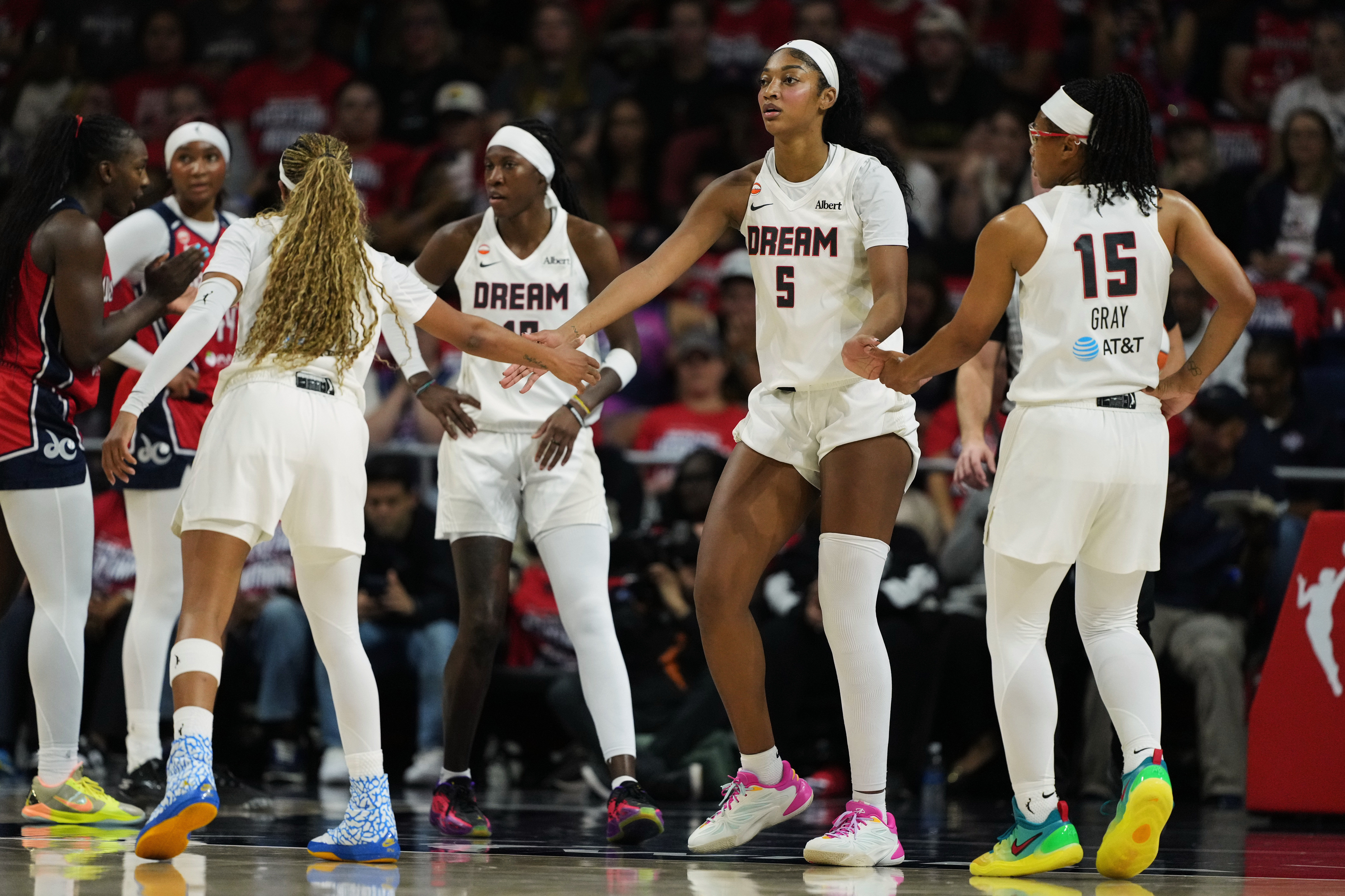 Atlanta Dream forward Angel Reese (5) celebrates with teammates after being fouled against during the first half in Game 2 of a WNBA basketball first-round playoff series against the Washington Mystics, Wednesday, Sept. 30, 2026, in Washington. 