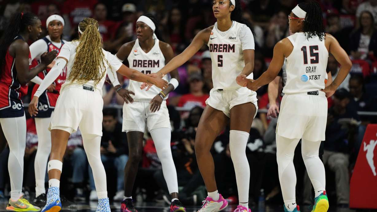 Atlanta Dream forward Angel Reese (5) celebrates with teammates after being fouled against during the first half in Game 2 of a WNBA basketball first-round playoff series against the Washington Mystics, Wednesday, Sept. 30, 2026, in Washington.