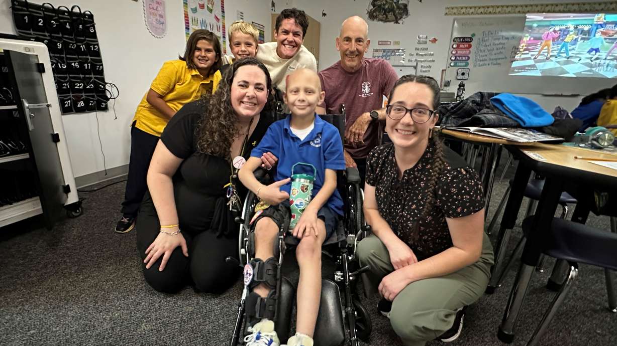 DJ Theorine with his mom, teacher, and those running in his honor during the Bear Canyon Trail Run. DJ, 8, was diagnosed with a rare bone cancer and is inspiring those around him with his determination, while his school, friends and community come together to support his fight.