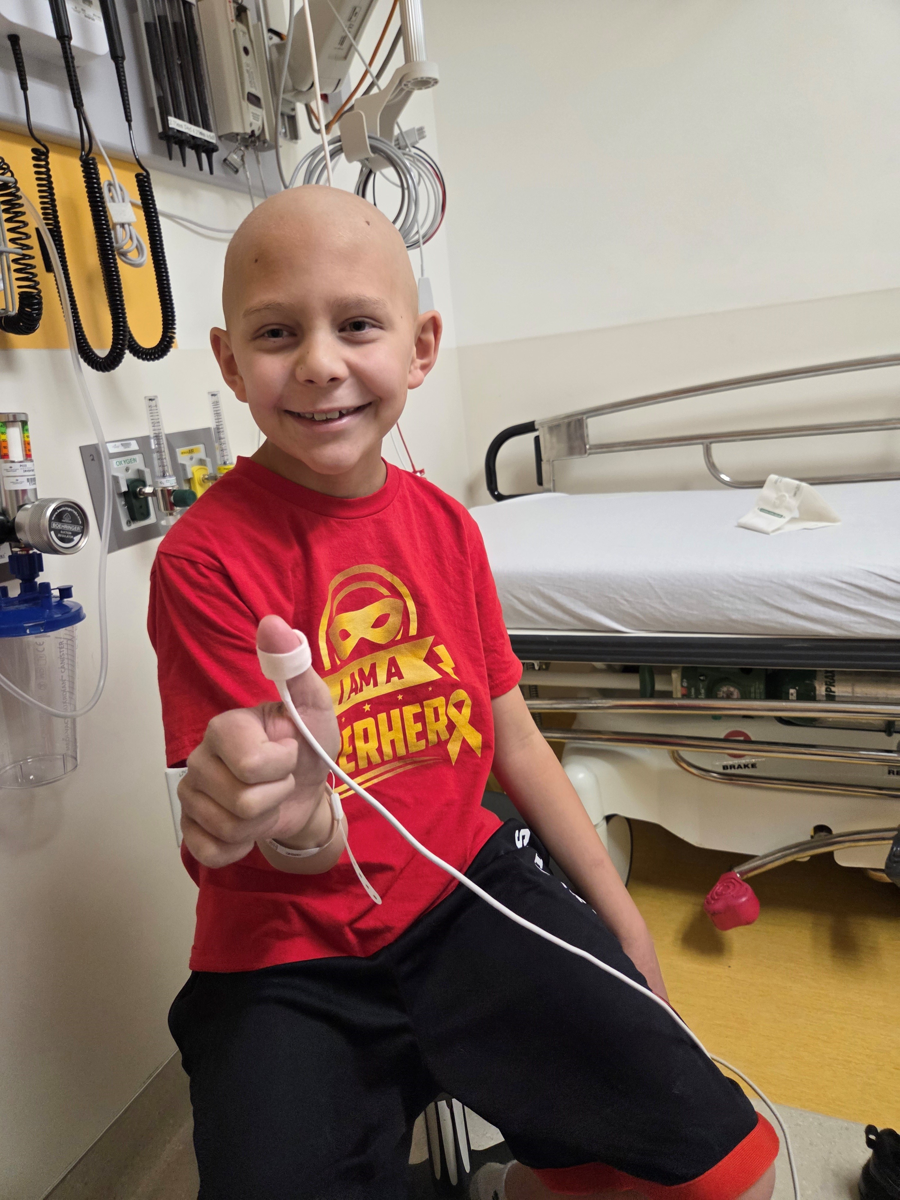 DJ is pictured at the hospital during treatment.
