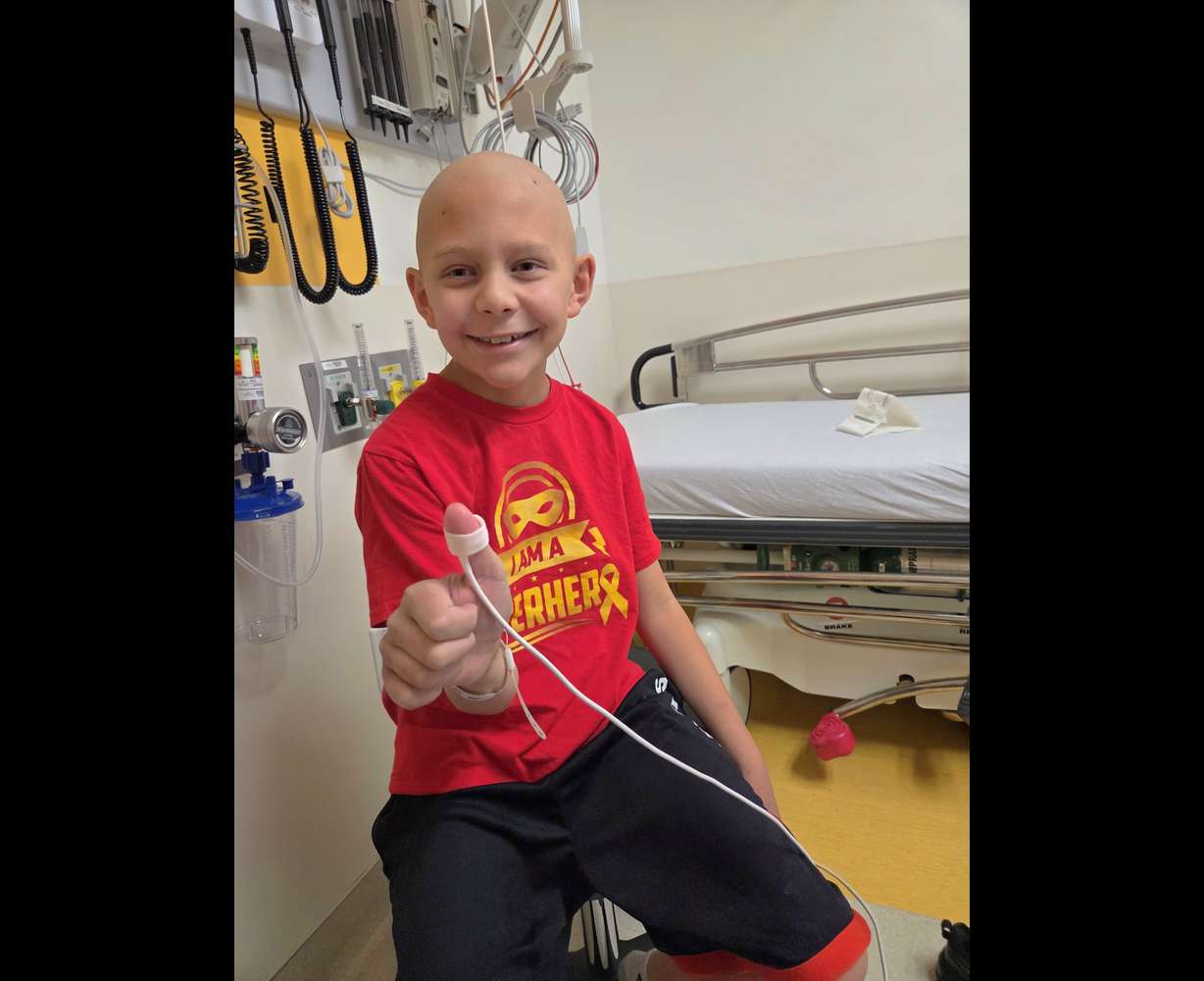 DJ is pictured at the hospital during treatment.