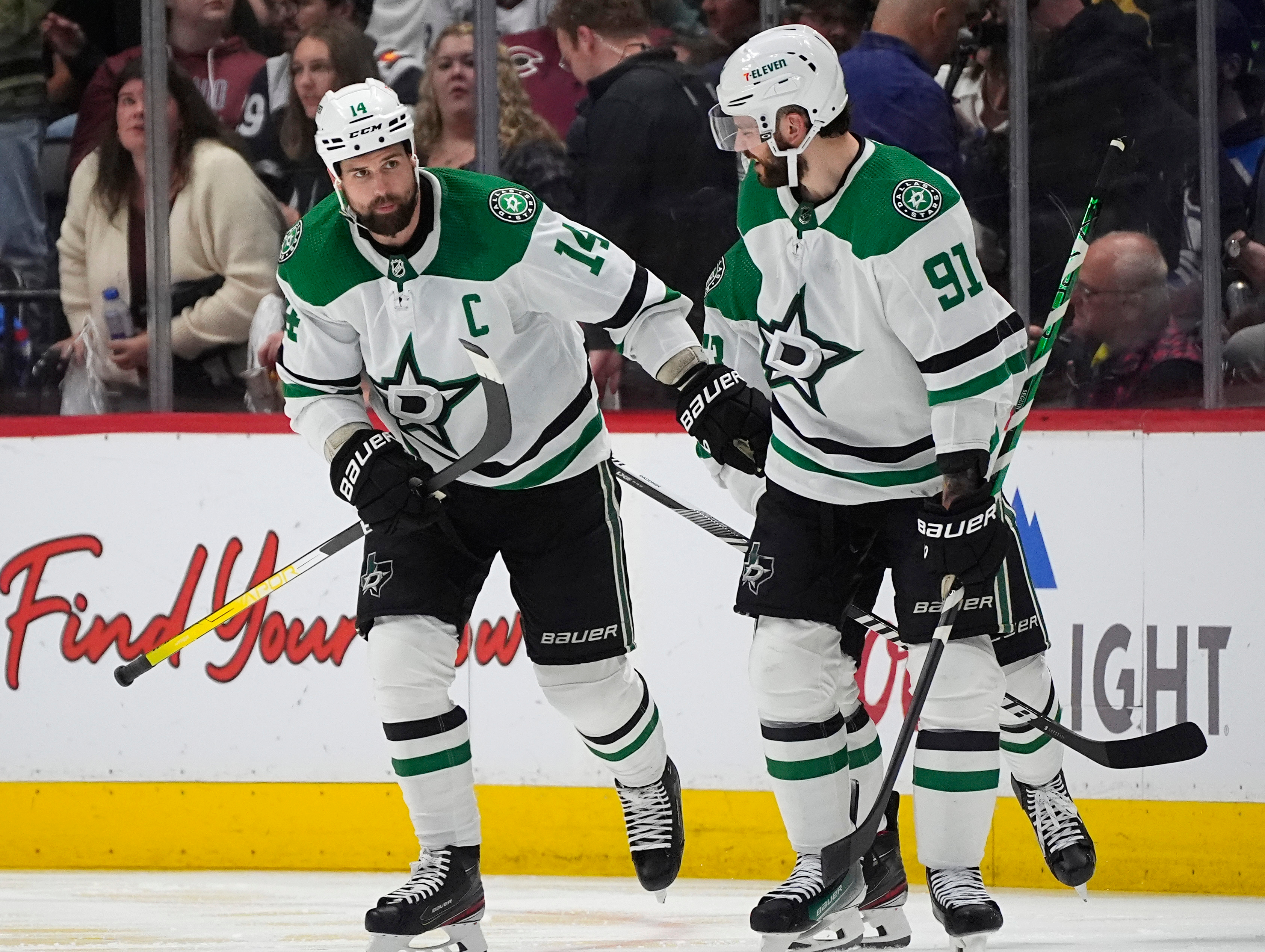 FILE - Dallas Stars left wing Jamie Benn, left, is congratulated by center Tyler Seguin for a goal against the Colorado Avalanche during the third period of Game 6 of an NHL hockey playoff series, May 17, 2024, in Denver. 