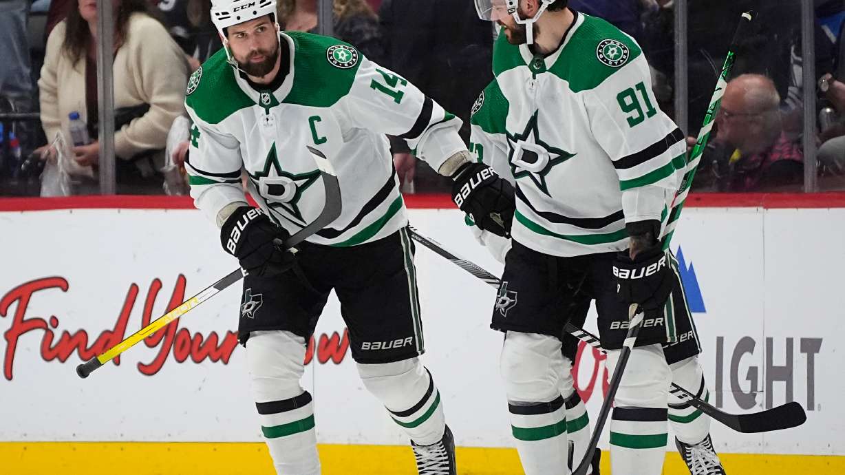 FILE - Dallas Stars left wing Jamie Benn, left, is congratulated by center Tyler Seguin for a goal against the Colorado Avalanche during the third period of Game 6 of an NHL hockey playoff series, May 17, 2024, in Denver.