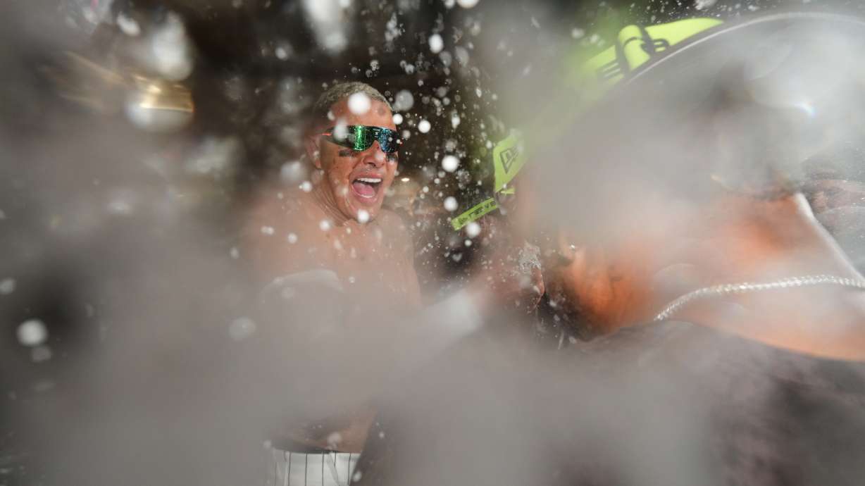 San Diego Padres third baseman Manny Machado celebrates with teammates after defeating the Chicago Cubs in Game 2 of the National League Wild Card baseball playoff series Wednesday, Sept. 30, 2026, in San Diego.