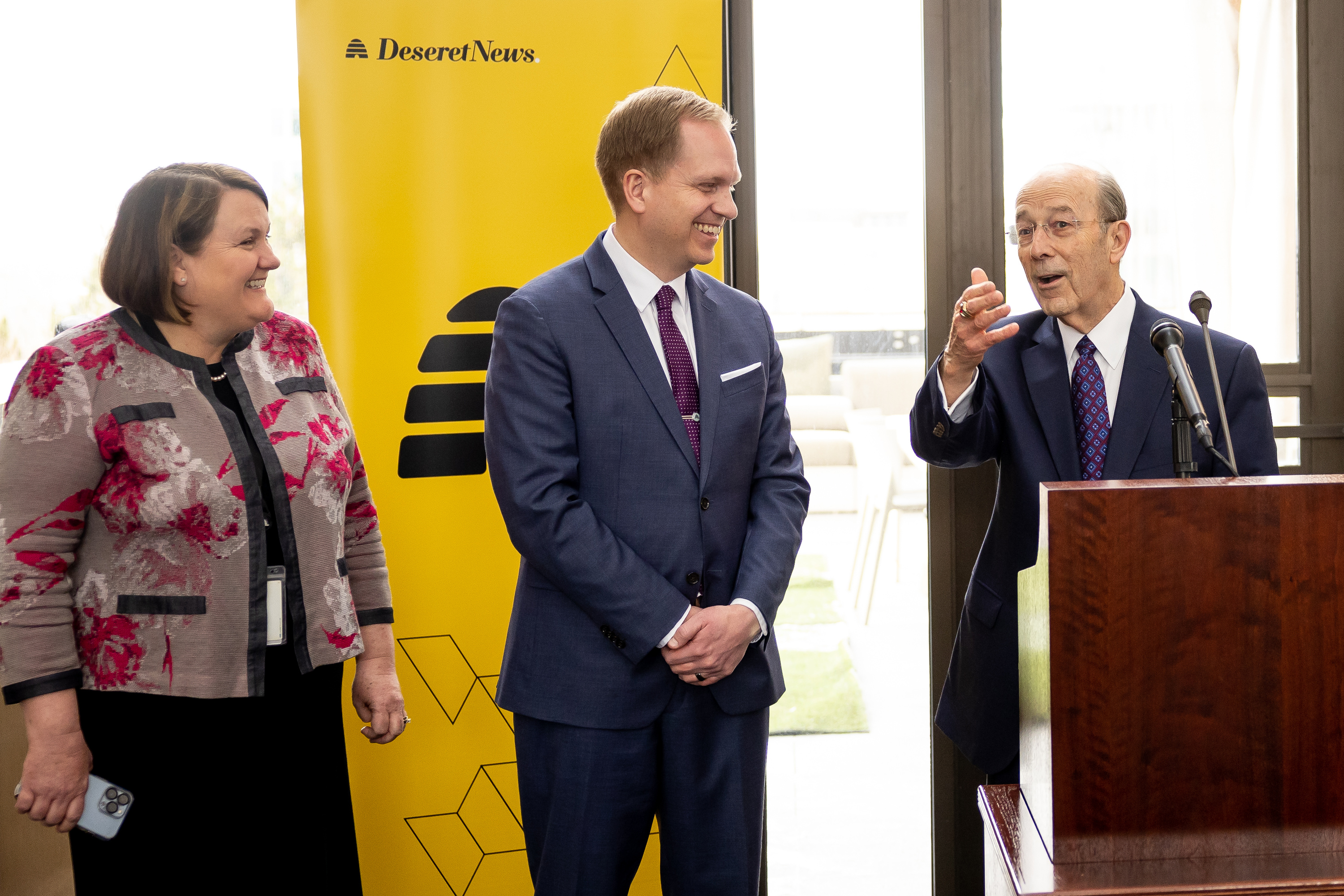 Keith McMullin, president and CEO of Deseret Management Corporation, announces Burke Olsen, as the new publisher of the Deseret News, with Sarah Jane Weaver, editor of the Church News, at the news organization’s office in Salt Lake City on Jan. 18, 2023. McMullin died on Wednesday at the age of 85.