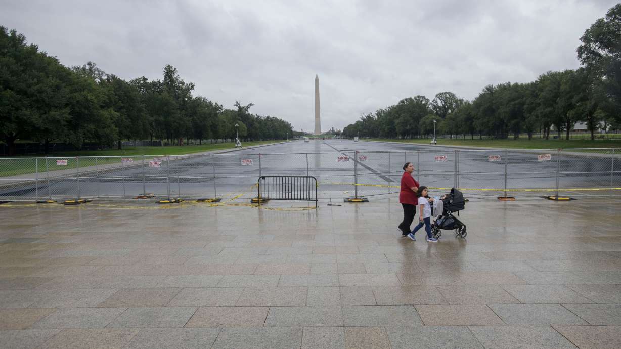 People pass by an empty Reflecting Pool at the Lincoln Memorial in Washington, Sept. 21. A judge on Thursday agreed to permanently dismiss a criminal case charging a former Olympian with vandalizing the Reflecting Pool.