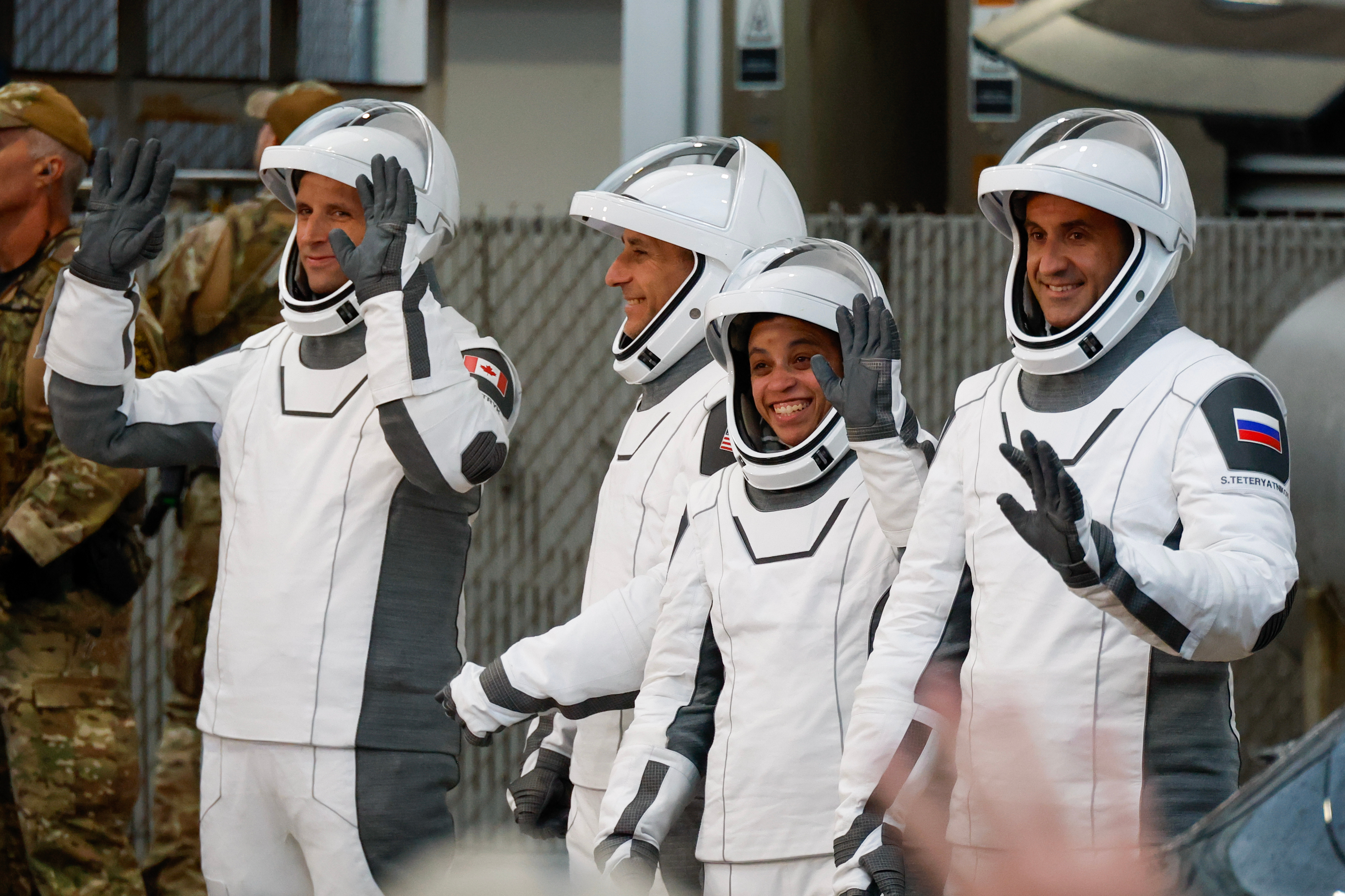 Astronauts, from left, Joshua Kutryk, of Canada, pilot Luke Delaney, commander Jessica Watkins and Cosmonaut Sergey Teteryatnikov, of Russia, leave the Operations and Checkout Building at the Kennedy Space Center in Cape Canaveral, Fla., Thursday.