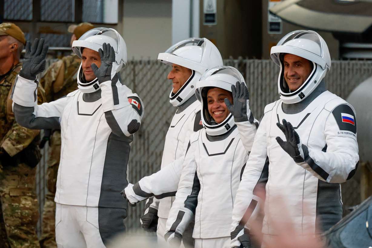 Astronauts, from left, Joshua Kutryk, of Canada, pilot Luke Delaney, commander Jessica Watkins and Cosmonaut Sergey Teteryatnikov, of Russia, leave the Operations and Checkout Building at the Kennedy Space Center in Cape Canaveral, Fla., Thursday.