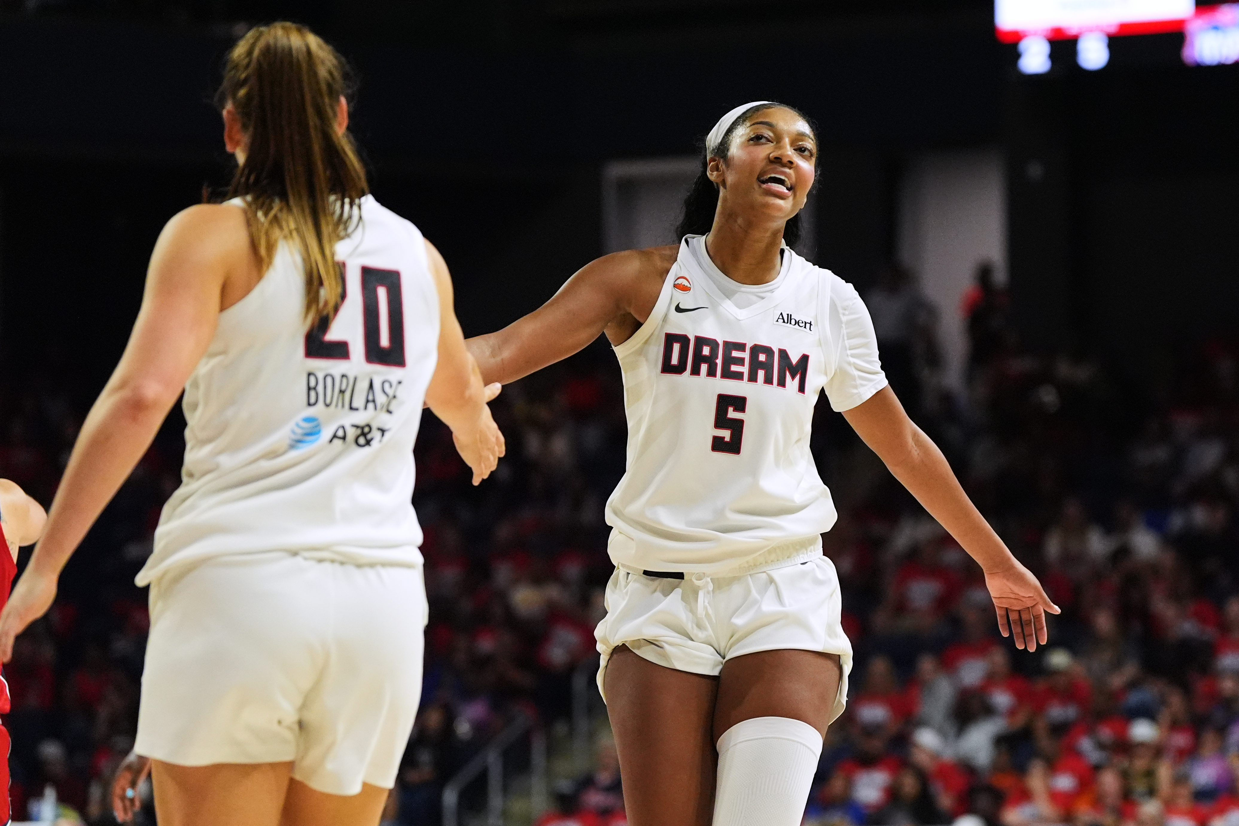Atlanta Dream forward Angel Reese (5) celebrates with guard Isobel Borlase (20) after their team was fouled against during the second half in Game 2 of a WNBA basketball first-round playoff series against the Washington Mystics, Wednesday, Sept. 30, 2026, in Washington. 