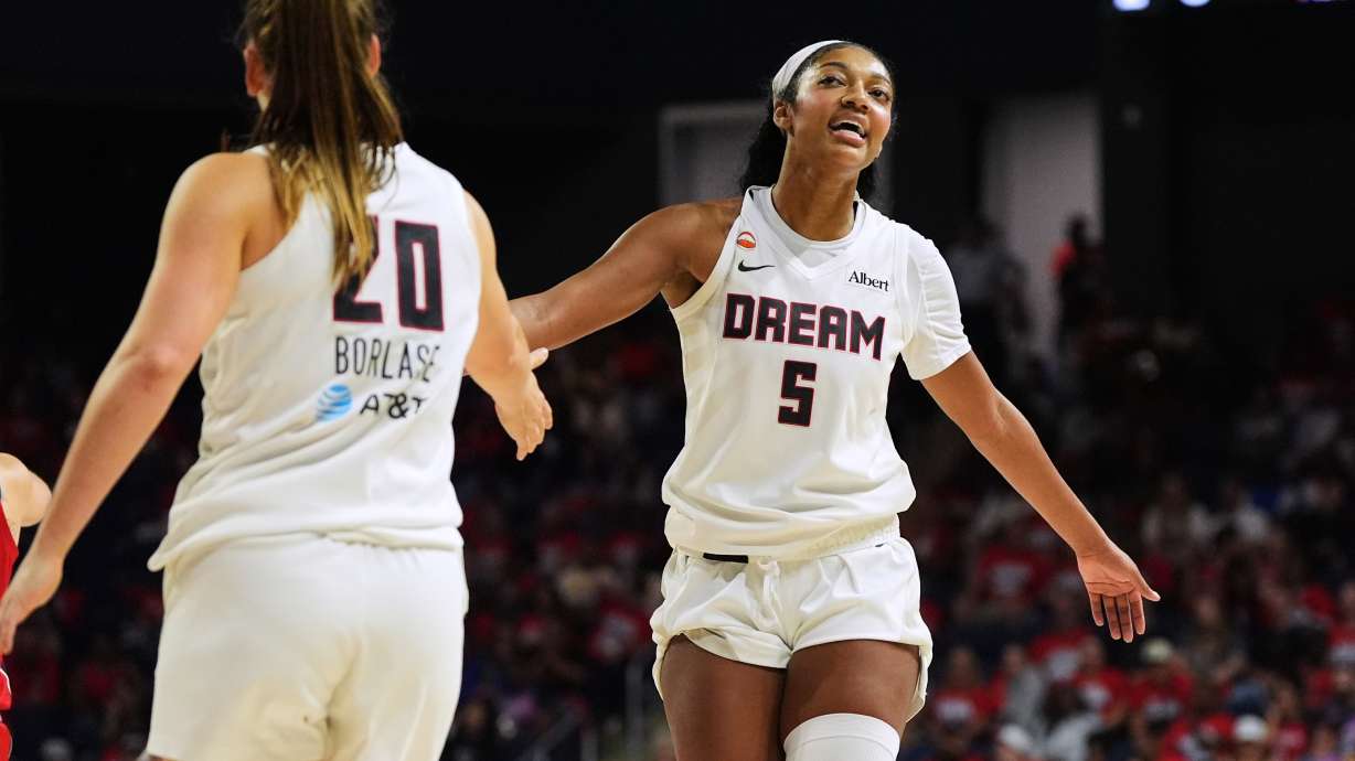 Atlanta Dream forward Angel Reese (5) celebrates with guard Isobel Borlase (20) after their team was fouled against during the second half in Game 2 of a WNBA basketball first-round playoff series against the Washington Mystics, Wednesday, Sept. 30, 2026, in Washington.