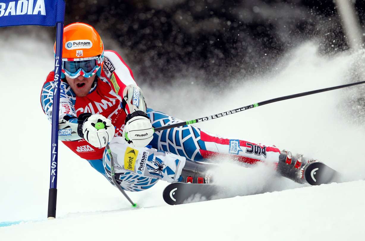 Ted Ligety of the United States passes a gate during the first run of an alpine ski men's World Cup giant slalom race, in Alta Badia, Italy, in this Sunday, Dec. 19, 2010, file photo.