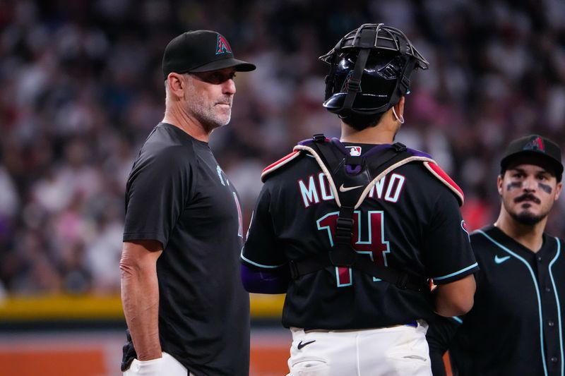 Sep 20, 2026; Phoenix, Arizona, USA; Arizona Diamondbacks manager Torey Lovullo (17) visits the mound during the third inning during the game against  the New York Yankees at Chase Field .