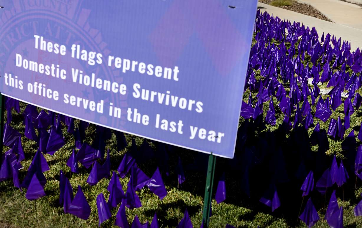 Purple flags are displayed during Domestic Violence Awareness Month at the Salt Lake County District Attorney’s Building in Salt Lake City on Thursday.