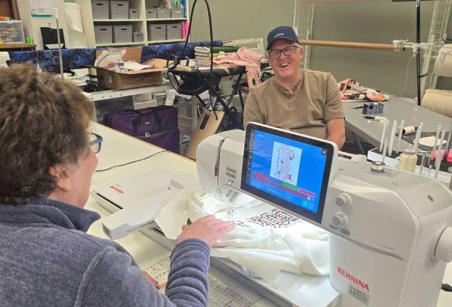 Customers smile as they work on a project at Granny’s Fabric House.