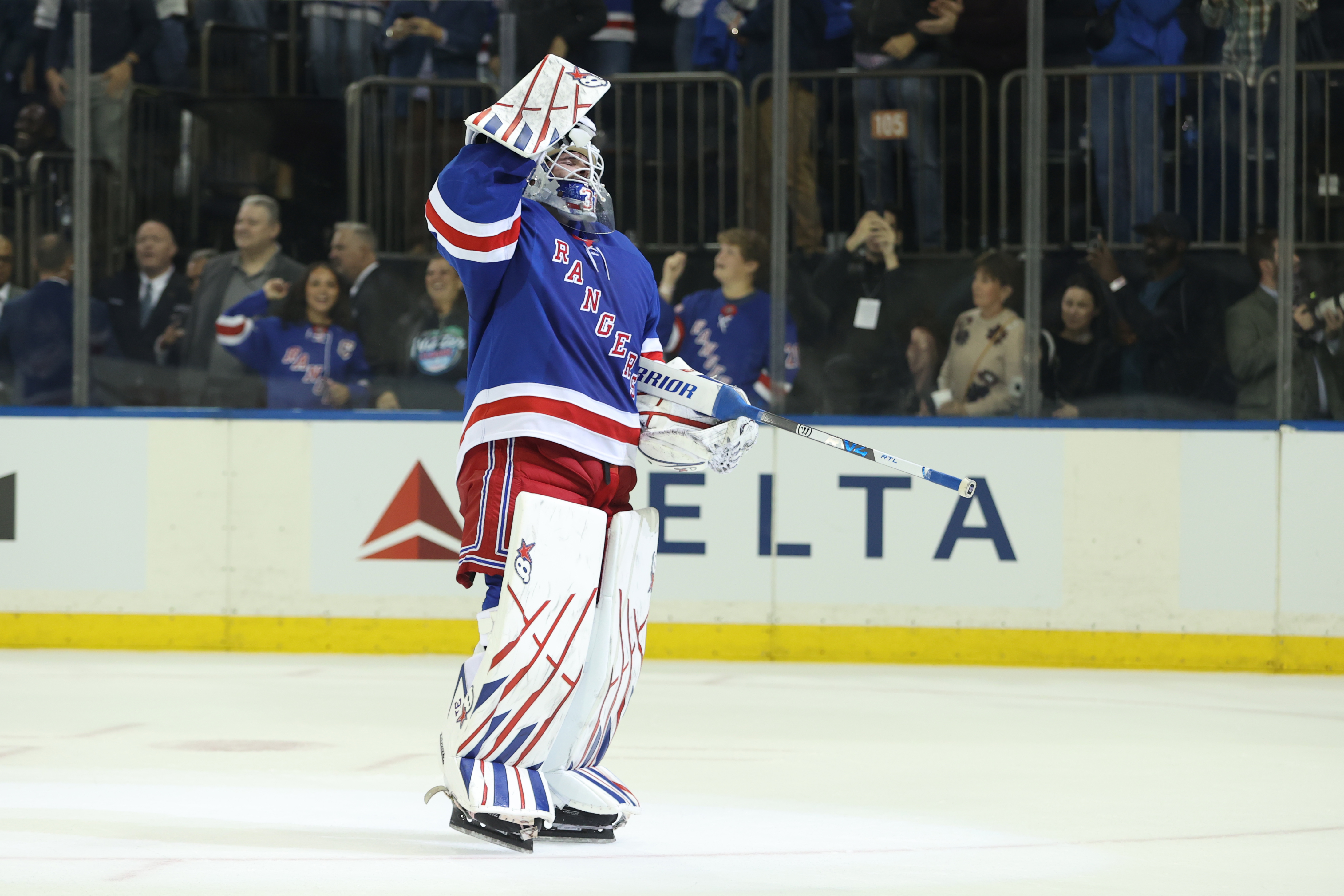 New York Rangers goaltender Igor Shesterkin reacts after scoring a goal during the third period of an NHL hockey game against the Tampa Bay Lightning Thursday, Oct. 1, 2026, in New York. 