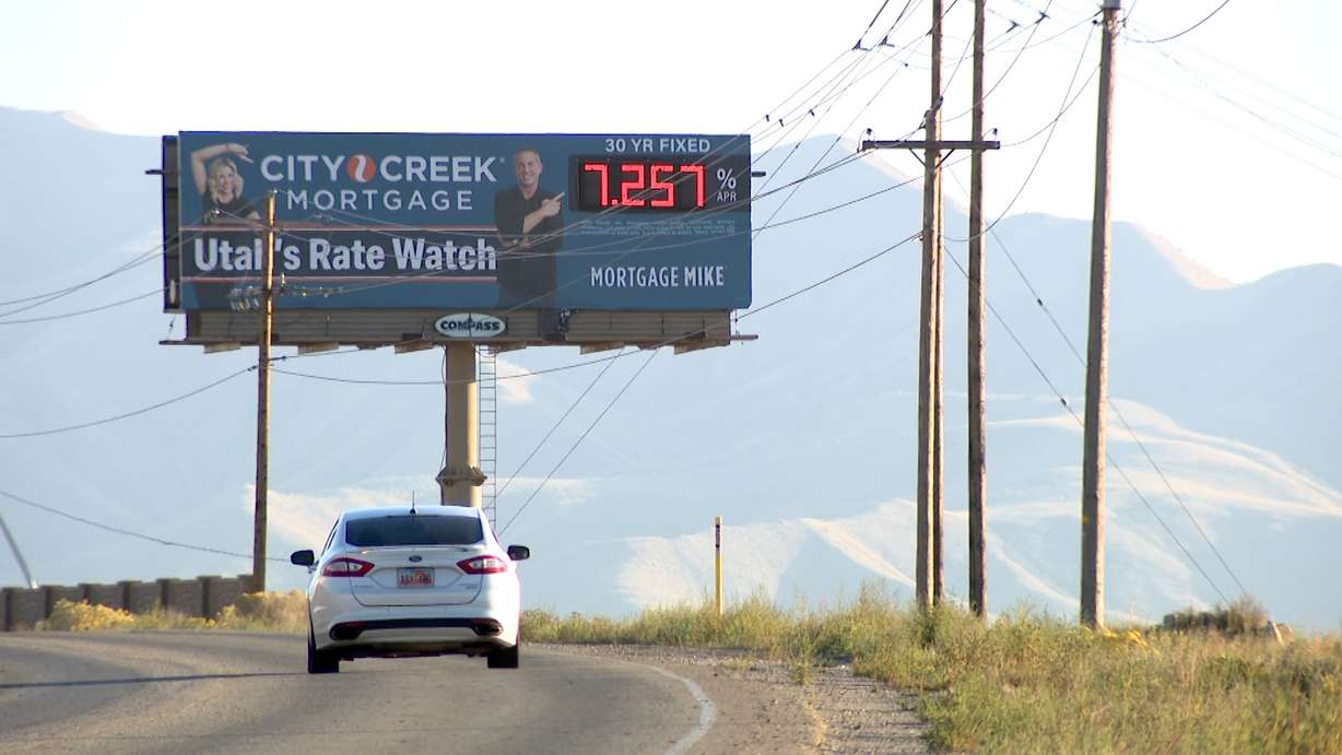 A sign advertising current interest rates is pictured in Bluffdale on Thursday.