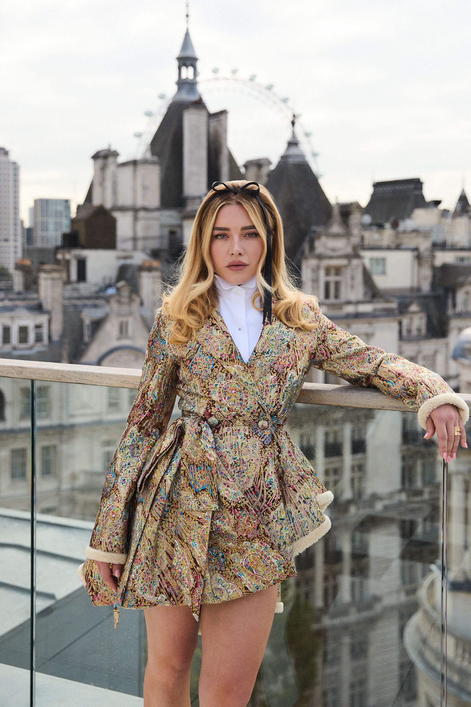 A Dior brocade jacket worn as as a mini dress at a photocall for "East of Eden" in London, UK