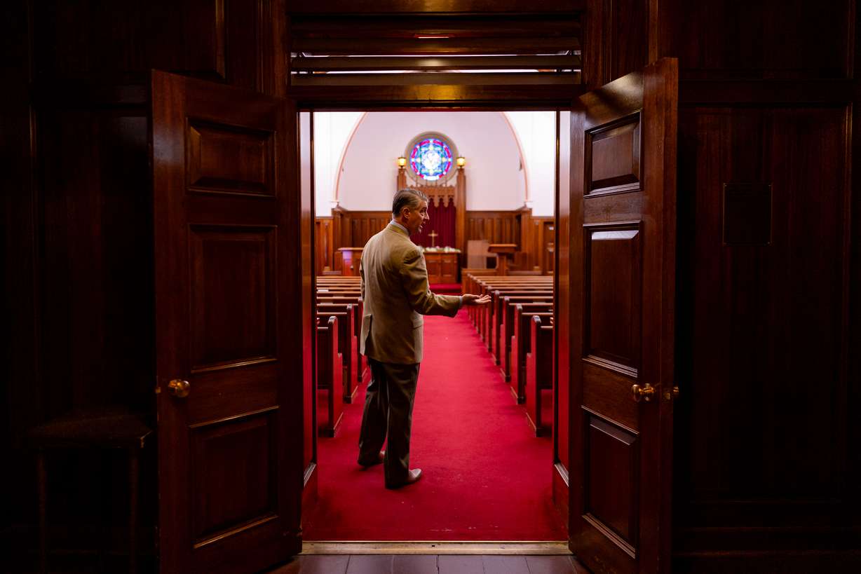 Pastor Curtis L. Price stands in Skaggs Chapel at First Baptist Church in Salt Lake City on Tuesday.