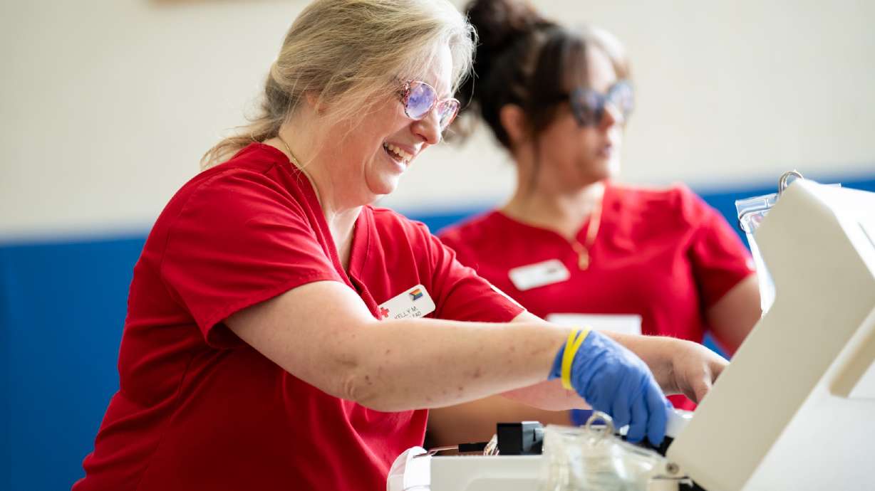 Kelly Monahan of the American Red Cross sets up a blood drive on June 19. The Church of Jesus Christ of Latter-day Saints announced Friday that it is donating $7 million to the American Red Cross to help with blood collection and disaster response.