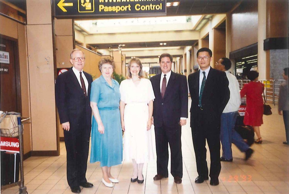 Elder John Carmack, Shirley Carmack, Janice White, Larry White, and Vichit Ith at the Don Mueang Airport in Bangkok, Thailand, before leaving for Cambodia on April 29, 1993. John Carmack was the president of the Asia Area for The Church of Jesus Christ of Latter-day Saints. Larry White was then president of the Thailand Bangkok Mission.