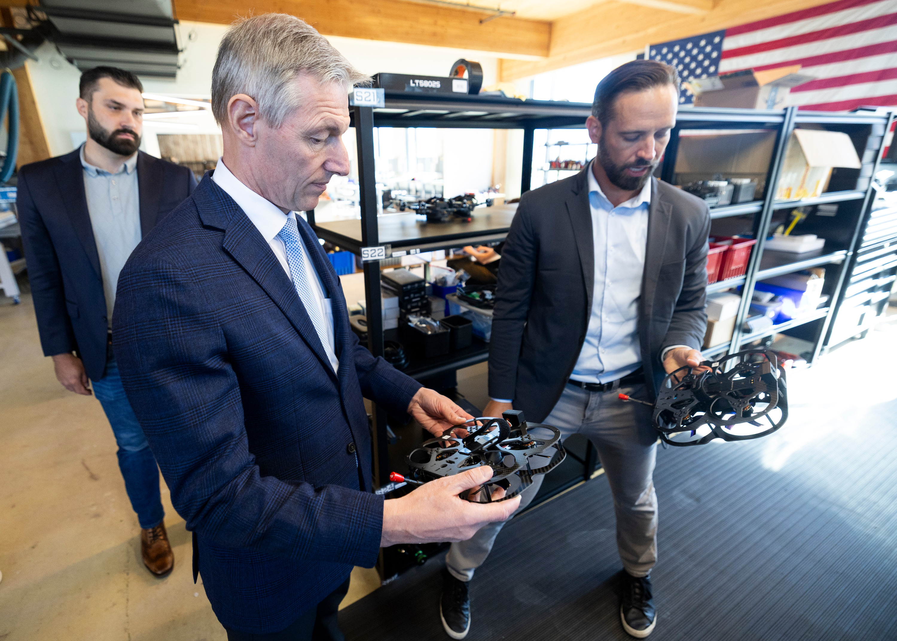 Rep. Mike Kennedy, R-Utah, left, inspects a drone during a tour of Vector's office from Vector CEO Andy Yakulis, right, in Draper on Tuesday, Aug. 19, 2025.